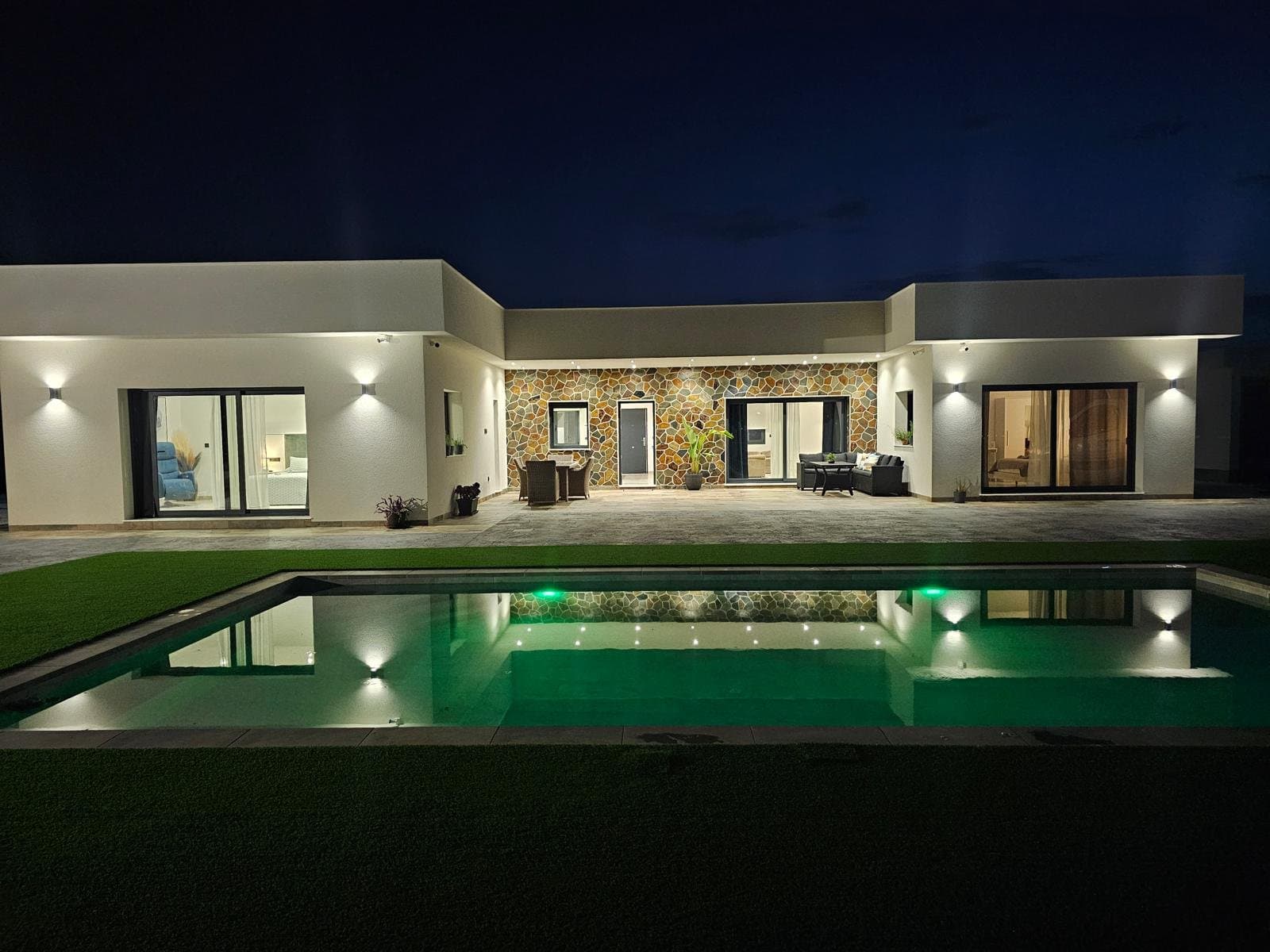 Step into a world of refined elegance with this exceptional new-build luxury villa, set on an expansive 11,436 m² private plot in the sought-after area of Ciudad Quesada, Costa Blanca. This is far more than a home it is a rare investment opportunity where space, privacy, and contemporary design come together in perfect harmony.Surrounded by nature yet just minutes from vibrant town life, the property offers breathtaking panoramic views and an unparalleled sense of tranquillity.Designed with both comfort and style in mind, this stunning one-level villa showcases modern architecture at its finest. The home features four spacious bedrooms and three beautifully appointed bathrooms, alongside a bright and expansive living area seamlessly connected to an open-plan kitchen—ideal for both everyday living and entertaining.At the heart of the outdoor space lies a spectacular private swimming pool, creating a serene retreat for relaxation under the Mediterranean sun. A closed garage and high-quality finishes throughout further elevate the property’s luxurious appeal.The villa is intelligently divided into two distinct wings, offering both privacy and versatility. One wing hosts two elegant bedrooms, while the opposite side features two additional bedrooms, including a magnificent master suite complete with a stylish en-suite bathroom and a spacious walk-in wardrobe.Every room has been carefully designed to capture natural light and maximize the stunning surrounding views.Crowning the property is a nice solarium, offering uninterrupted panoramic views across the landscape—perfect for sunset evenings or entertaining guests. With construction still in progress, there is also the exciting possibility to add an additional floor, allowing you to further customize and expand the home to suit your vision.Properties of this scale and privacy are exceptionally rare in this region. This villa offers not only a luxurious residence but also a vast estate with endless possibilities whether for landscaping, leisure facilities, or future development.Ideally positioned between Ciudad Quesada and Los Montesinos, the property offers the perfect balance between seclusion and convenience.Just 5 minutes from shops, restaurants, and local amenitiesOnly 10 minutes from the beautiful beaches of Guardamar del Segura