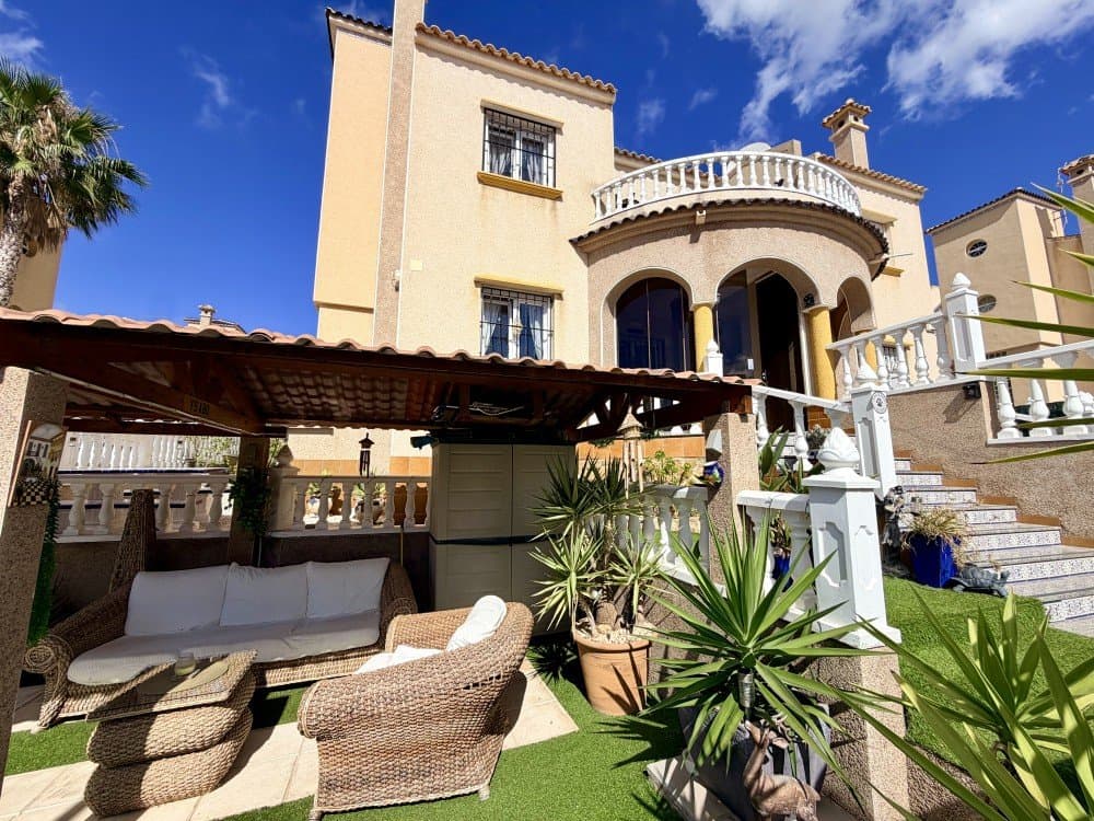 Situated in one of the most sought-after areas of Villamartin, Orihuela Costa, this beautifully presented semi-detached property offers the perfect blend of comfort, style, and convenience. Ideally located close to a wide range of amenities, including shops, supermarkets, and renowned shopping centres such as La Zenia Boulevard, as well as being just a short drive from the stunning Mediterranean beaches, this home truly ticks all the boxes.The property is in immaculate condition throughout, having been exceptionally well maintained by its current owners, meaning it is ready to move into with no work required.Upon entering the plot, you are welcomed by a charming garden area featuring a carport, currently used as a pergola an ideal space for enjoying al fresco dining in complete tranquillity. The entrance to the home leads through a delightful glazed porch, offering yet another inviting space to relax and enjoy meals all year round in total comfort.The property is distributed over three levels. On the ground floor, you will find a spacious and bright living room complete with a fireplace, creating a warm and inviting atmosphere. The open-plan kitchen is generously sized and finished to a high standard. This level also includes a double bedroom with fitted wardrobes and a full bathroom, making it perfect for those who prefer or require single-level living.The first floor comprises two large double bedrooms, one of which has access to a private balcony perfect for enjoying the Mediterranean breeze and pleasant views. There is also a spacious modern bathroom featuring a walk-in (Italian-style) shower and a window for natural light and ventilation.From this level, stairs lead up to the impressive solarium, which offers fantastic views and has been beautifully maintained. Here you will discover a unique and charming feature: a fully fitted bar area, ideal for entertaining friends and family. This space is perfectly complemented by a jacuzzi, making it an exceptional spot to unwind and enjoy warm summer evenings.The property is sold partially furnished.All windows are double glazedThere are aircon units in all bedrooms and lounge. This is a rare opportunity to acquire a turnkey home in a prime location. Contact us today to arrange a viewing and experience everything this exceptional property has to offer!!