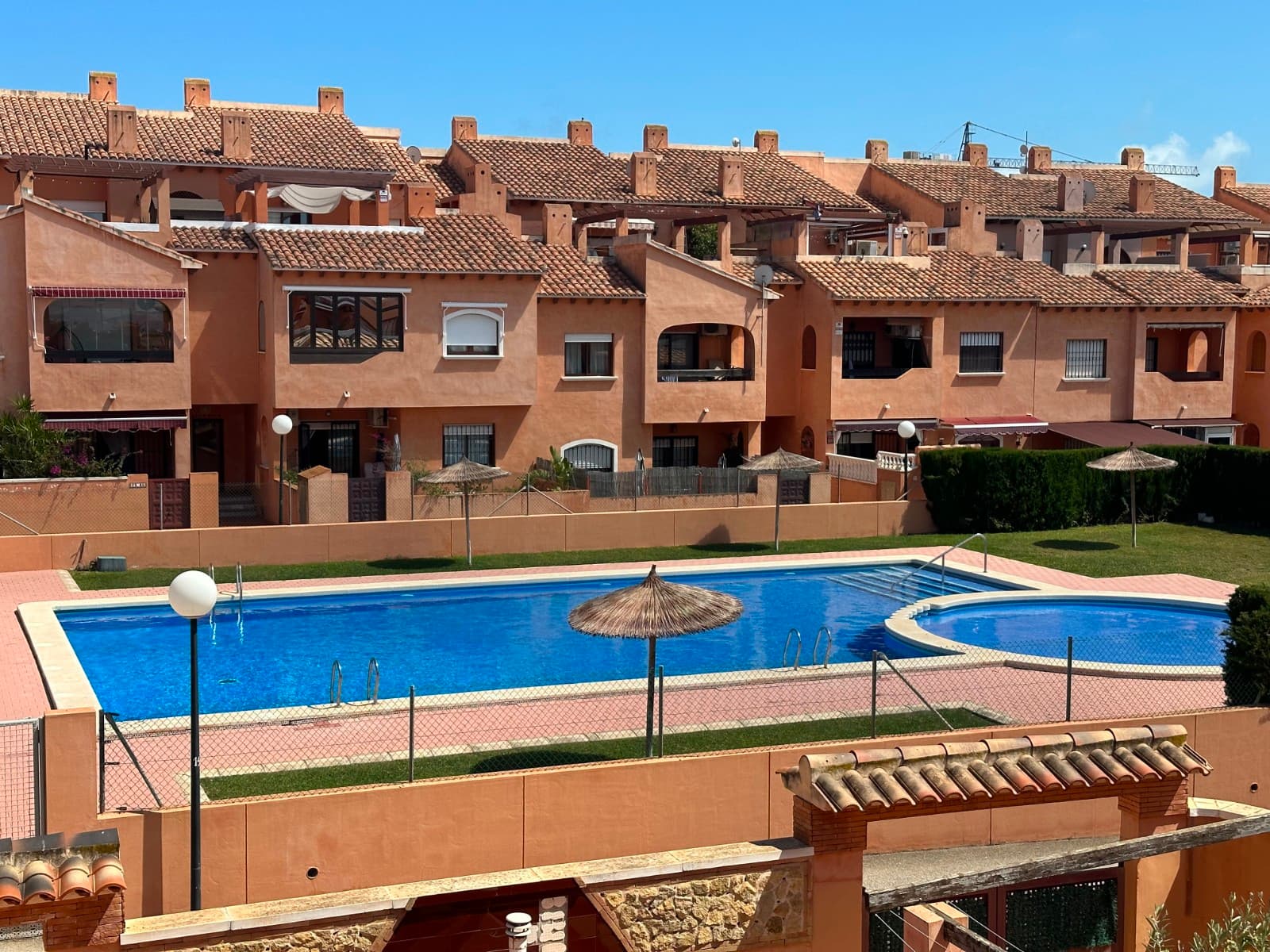 Located in the sought-after gated complex Altos del Sol II in Torrevieja, this charming top-floor apartment offers the perfect blend of comfort, space, and Mediterranean lifestyle.The property features three well-proportioned bedrooms and a modern bathroom, ideal for both permanent living and holiday use. At the heart of the home is a bright and spacious living area with an open-plan kitchen, creating a sociable and airy environment filled with natural light.One of the standout features is the impressive 40m² private terrace, wrapping around the property and providing ample space for outdoor dining, sunbathing, and relaxation. From here, you can enjoy pleasant open views overlooking the communal pool and surrounding gardens, enhancing the sense of tranquility.The apartment is sold fully furnished and equipped with air conditioning, ensuring year-round comfort and convenience. It also benefits of a parking space inside the complex.Situated in a well-maintained residential complex with a large communal swimming pool and landscaped areas, the location is equally appealing. You are just 1 km from the beautiful beaches of the Costa Blanca, including Playa de Los Locos, and within easy walking distance of shops, restaurants, cafes, and all essential amenities. This is an excellent opportunity to enjoy a relaxed coastal lifestyle in one of Torrevieja’s most desirable areas, whether as a holiday retreat, rental investment, or permanent residence.