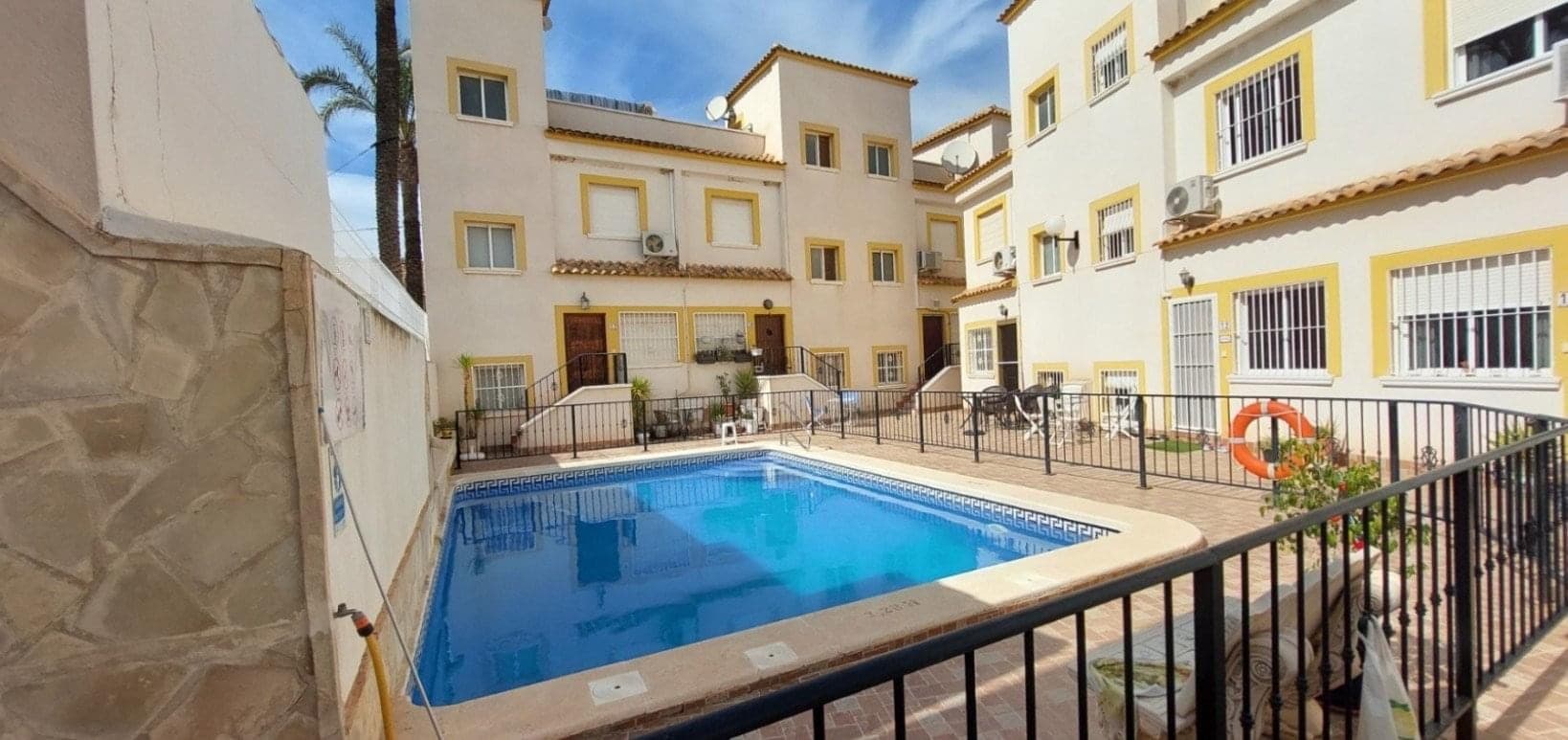 Location: Torremendo, Orihuela Region, Alicante, SpainPrice: 120,000Specs: 2 Bedrooms | 2 Bathrooms | Private Rooftop Solarium | Low-Maintenance Village LivingExperience the charm of true Spanish village living in this beautifully maintained, 2-bedroom townhouse nestled in the heart of Torremendo. This property offers the ultimate low-maintenance "lock-up-and-go" lifestyle—ideal for anyone wanting a character-filled home without the upkeep of a garden. Step out your front door directly onto quiet, village streets, with traditional tapas bars and breathtaking nature trails just a short stroll away.Interior & LayoutSpanning across four levels, this home seamlessly blends traditional Spanish architecture with modern comforts.Living Area: A cozy, welcoming lounge and dining area featuring high ceilings and plenty of natural light.Kitchen: A fully fitted, functional kitchen equipped with modern appliances and ample cabinet space.Bedrooms: Two comfortable double bedrooms. The master bedroom features large windows and balcony overlooking the peaceful village street.Bathrooms: A modern, fully tiled family bathroom with a walk-in shower.The Location: A Nature Lover's ParadiseTorremendo is a peaceful, authentic village famous for its dramatic scenery and slow pace of life. The village is right next to the Embalse de la Pedrera, a vast, turquoise reservoir and protected nature reserve beloved by hikers, cyclists, and birdwatchers.The village center offers everything you need for daily life: a bakery, grocery shop, pharmacy, butcher, medical center, and highly rated local restaurants serving authentic regional cuisine.Location Highlights:Nature: 2 minutes to the La Pedrera reservoir and nature trails.Amenities: 10 minutes to the larger town of San Miguel de Salinas.Golf & Beaches: 20 minutes to award-winning golf courses and 25 minutes to the blue-flag beaches of Orihuela Costa and Torrevieja.Airports: 45 minutes to both Alicante and Murcia International airports.Our Take: If you love the idea of a character-rich, traditional Spanish home where you can just turn the key and leave without worrying about weeding or watering a garden, this townhouse is an absolute must-see. Contact us today to book your viewing!