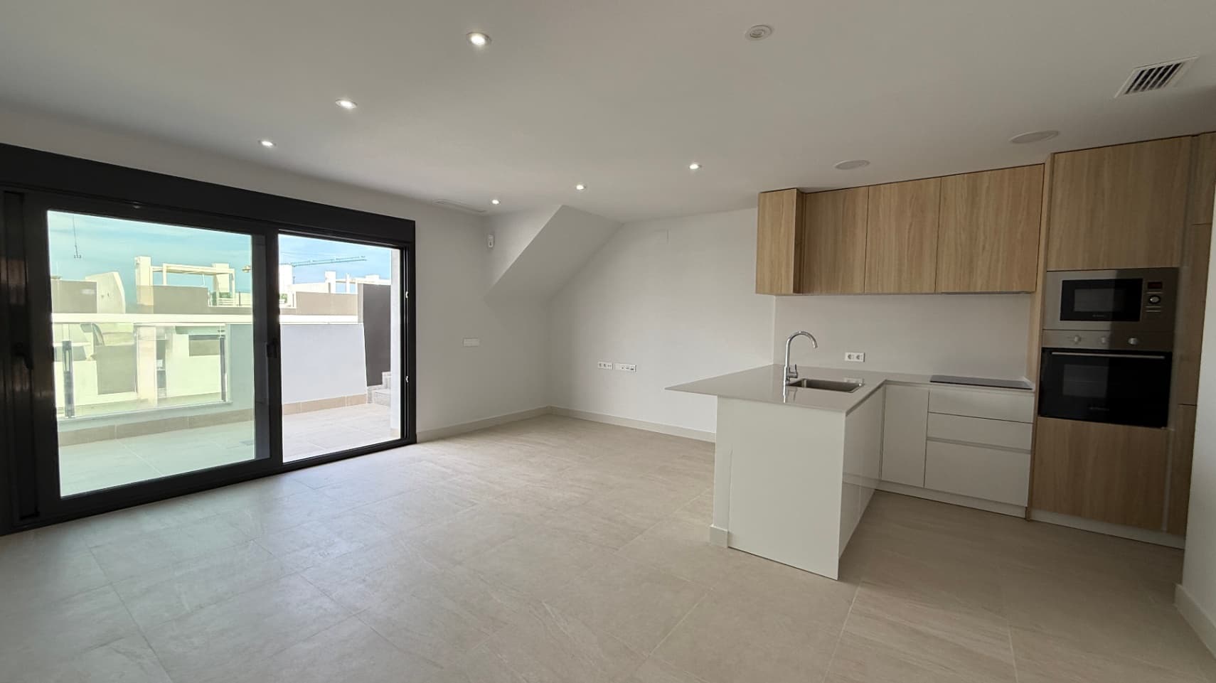 Located in the captivating city of Torrevieja, this modern apartment promises to be the ideal retreat for those seeking a comfortable and relaxing lifestyle. With a built area of 115 m² and usable space of 110 m², every corner of this home has been designed to maximize space and natural light.Space DistributionThe apartment features 2 cozy bedrooms, perfect for enjoying the tranquility and rest you deserve. A well-distributed bathroom provides functionality and comfort. The open-plan kitchen seamlessly integrates with the living room, creating an open and welcoming atmosphere, ideal for sharing moments with family or friends.Enjoy the OutdoorsOne of the great charms of this apartment is its 22.80 m² terrace, a perfect space to enjoy the Mediterranean climate. Imagine relaxing with a cup of coffee in the morning or hosting outdoor dinners while enjoying the views. The east orientation ensures you can enjoy the sun during the morning hours, filling your home with light and warmth.Amenities and ServicesThe community in which the apartment is located offers a communal pool, ideal for cooling off during the warm summer days. Additionally, the building features parking for your convenience and is designed with a modern style, providing not only aesthetics but also functionality in the distribution of its spaces. The good communications with the main access roads make navigating the city quick and comfortable.A Place to Call HomeThis apartment in Torrevieja represents not just a housing option, but a lifestyle in a vibrant environment full of opportunities. Nearby cities, natural beauty, and an enviable climate make this property a place where your dreams can come true. The Costa Blanca is known for its recreational and relaxation possibilities, offering a range of activities and attractions to enjoy year-round.Don’t miss the opportunity to live in this magnificent apartment that, more than just a physical space, is a home filled with potential and warmth.