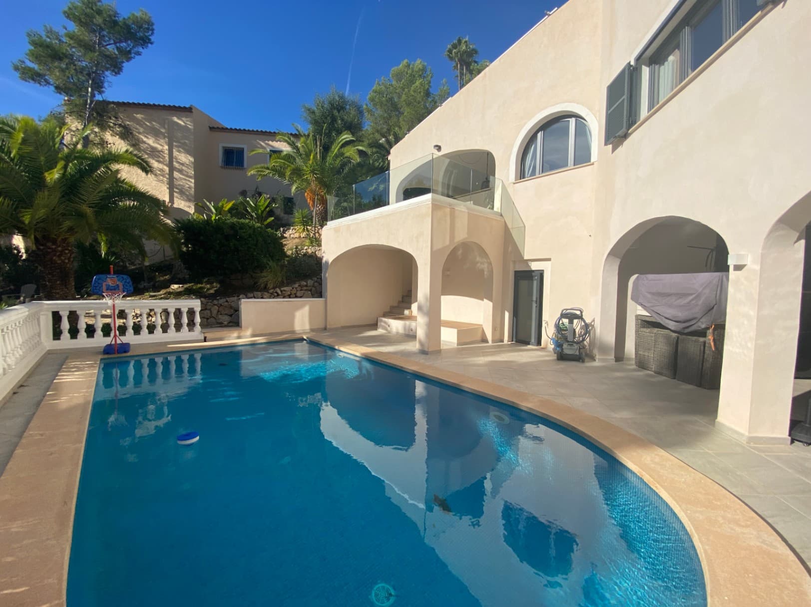 This charming villa, fully renovated in 2022 and holding a holiday rental license, is situated on a spacious plot of approximately 1,260 m² in a quiet residential area of Costa de la Calma. Combining Mediterranean charm with modern comfort, it offers around 205 m² of living space — perfect for those seeking privacy and relaxation in one of the most desirable areas in southwest Mallorca.The property features four bedrooms and three bathrooms, one of which is en-suite and directly connected to the master bedroom, ensuring maximum comfort and privacy. There is also a guest toilet.The interior impresses with high-quality finishes and a well-thought-out layout. A modern open-plan kitchen with top-quality appliances integrates seamlessly with the spacious living area featuring a fireplace — ideal for cozy evenings. Large-format tiles create an elegant and easy-to-maintain ambiance.Additional amenities include a utility room, storage room, built-in wardrobes, a basement, and a multi-purpose room. Comfort is guaranteed all year round thanks to air conditioning (hot/cold) and efficient oil central heating. Double-glazed aluminum windows with matching shutters ensure excellent thermal and sound insulation.The outdoor area is designed for enjoying the Mediterranean lifestyle to the fullest, offering a large swimming pool with an outdoor shower, a fully equipped summer kitchen with BBQ area, and a chill-out lounge — perfect for relaxing or entertaining family and friends.The property includes two outdoor parking spaces and two garage spaces, both secured by an electric entrance gate and automatic garage door.Disclaimer: Certain information contained herein is derived from information provided by owners / collaboators. All information provided is deemed reliable, but is not guaranteed to be accurate and should be independently verified.