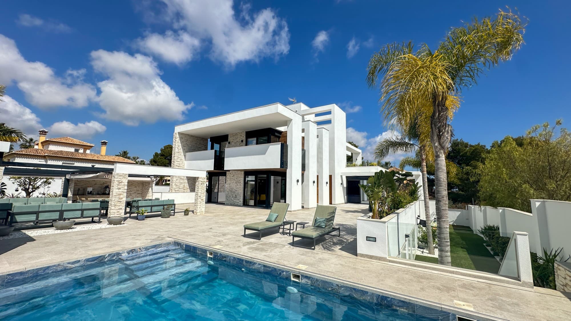 Ultra-Luxury Golf & Sea View Villa in Villamartín – The Pinnacle of Mediterranean LivingIndulge in the ultimate expression of luxury with this extraordinary villa in the heart of Orihuela Costa. Perfectly situated a minute from the elite Villamartín Golf Club, this residence offers seamless access to gourmet restaurants, chic bars, premium services, and boutique shopping. The golden sands of the Costa Blanca and the renowned La Zenia Boulevard are just five minutes away, while international travelers benefit from unmatched connectivity between Alicante–Elche Miguel Hernández Airport and Region of Murcia International Airport.Set on a 1,008 m² south-west facing plot, this masterpiece encompasses 527 m² of exquisitely crafted living space, offering three palatial en-suite bedrooms, including a 38 m² master sanctuary with a walk-in closet and private terrace overlooking breathtaking sea views. Two guest toilets and a 163 m² open-plan living and gourmet kitchen—featuring designer woodwork and premium appliances—combine elegance with effortless functionality.This villa is a triumph of modern engineering and sustainable luxury: underfloor heating throughout, a heated infinity pool, solar panels, 30 times 550kw, inverter of 20kw and a system that makes all the panels work even if there is shade of 1 or more. zoned central air-conditioning, and a private elevator connecting all floors ensure ultimate comfort and convenience. Expansive outdoor terraces, an outdoor kitchen, and landscaped gardens provide the perfect backdrop for grand entertaining or serene relaxation under the Mediterranean sun.The villa’s basement hosts a fully independent one-bedroom apartment with en-suite bathroom, living space, and kitchen—ideal for VIP guests or luxury rental income. A double garage with extensive storage completes this unparalleled residence.Every detail of this property has been meticulously curated for those who demand the finest: from golf-front prestige to coastal sophistication, this villa offers a once-in-a-lifetime opportunity to own a statement home that defines Mediterranean luxury at its zenith.