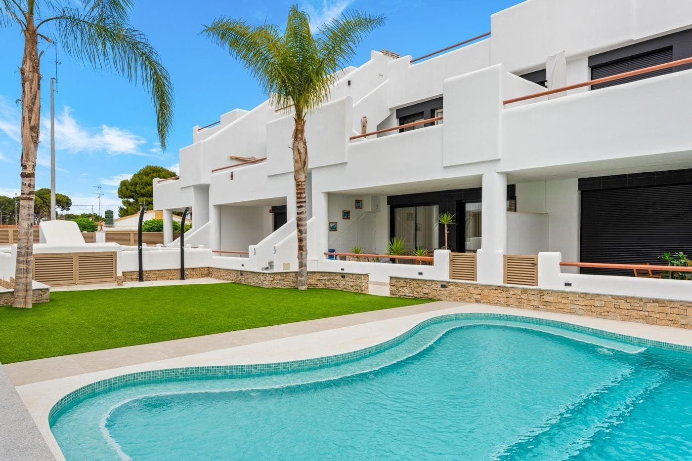 Welcome to this exclusive penthouse, located in a small-scale, gated community that guarantees peace, security, and an intimate atmosphere. Less than 100 meters from the beach, you can enjoy the ultimate holiday feeling here every day, all year round.The property exudes a refined Ibiza style, featuring light tones, natural materials, and a seamless indoor-outdoor living experience. Inside, you will find 2 stylish bedrooms and 2 bathrooms, combined with a bright living area that flows effortlessly into the outdoor space.The absolute highlight is the spacious sun terrace: a unique place where luxury and comfort come together. Here you will find a fully equipped, high-quality outdoor kitchen — perfect for long, relaxing evenings, dining with friends, or simply enjoying the Mediterranean climate in complete privacy.This penthouse is offered largely furnished and finished to perfection, allowing you to move in and start enjoying immediately.A rare opportunity for those looking for a stylish second home or an exclusive seaside residence in a peaceful and well-maintained community.This property is intended for owner-occupancy only. Rental is not permitted.