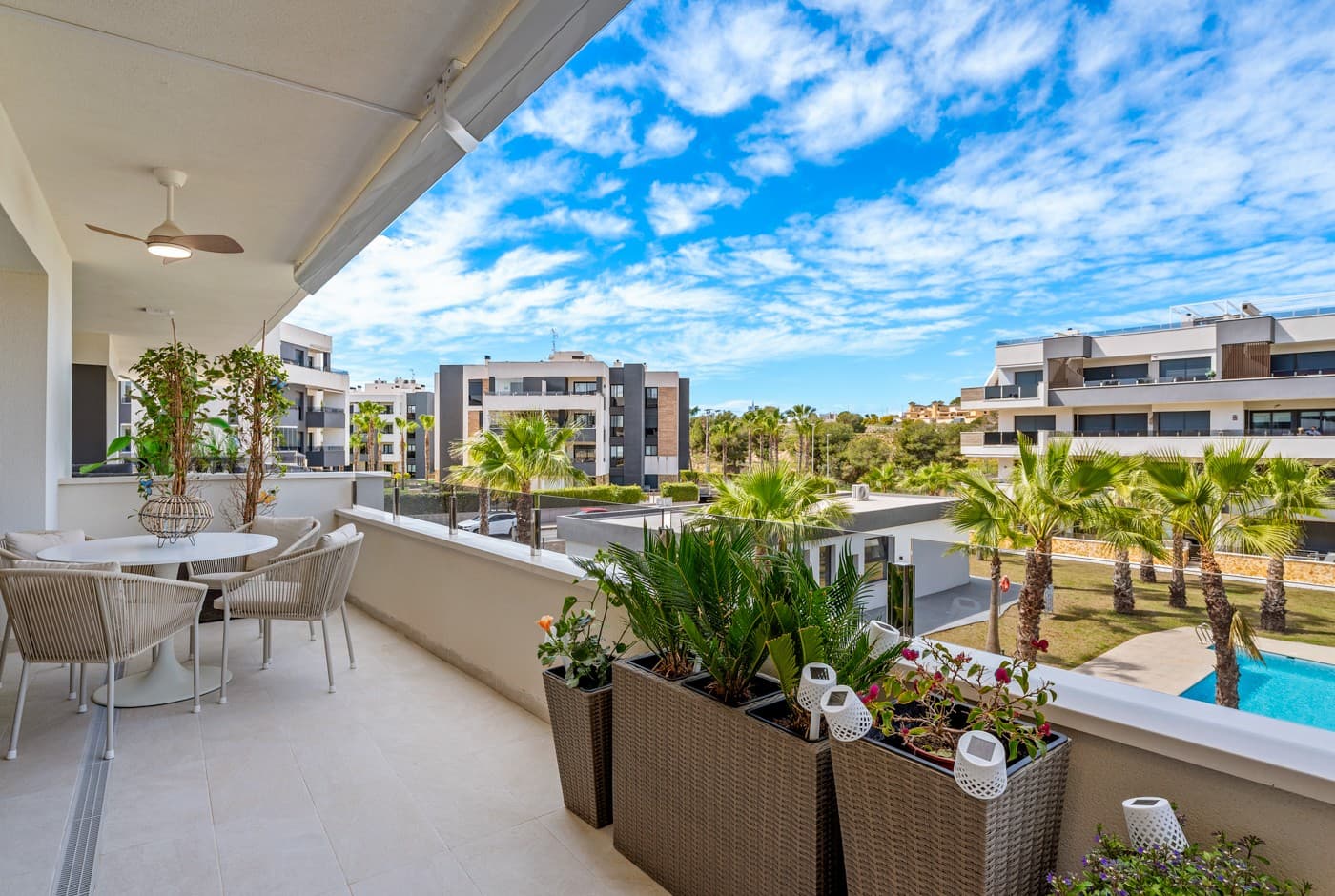 Luxury apartment in Resort Amanecer X, located in the popular area of Los Altos in Orihuela Costa. This stylish and contemporary apartment was completed in 2024 and represents an excellent opportunity as a holiday home, permanent residence, or investment with strong rental potential.The apartment features a bright, open-plan living room with kitchen and dining area, designed to maximize space and natural light. Large windows create an airy atmosphere and provide direct access to a spacious private terrace, seamlessly blending indoor and outdoor living. The kitchen is fully equipped with modern appliances and finished in a sleek, contemporary style that integrates perfectly with the living space.There are two spacious bedrooms, both with built-in wardrobes and located on the terrace side of the apartment, as well as two modern bathrooms finished to a high standard. The apartment is sold fully furnished and has a total surface area of 65 m², offering a practical and well-balanced layout.One of the standout features is the generous private terrace of over 25 m², overlooking the landscaped gardens and communal swimming pool. Thanks to its southwest orientation, the terrace enjoys excellent sun exposure, making it ideal for relaxing or outdoor dining.The apartment is located on the first floor of building number 8 with an elevator and includes an underground parking space and a private storage room. It is equipped with air conditioning, an Airzone climate control system, underfloor heating in the bathrooms, and electric shutters, ensuring year-round comfort. The property is in perfect condition, fully furnished, and ready to move in!Residents of Amanecer X enjoy a resort-style environment with access to a large communal swimming pool, a children’s pool, a fully equipped gym, as well as a jacuzzi and sauna. All of this is surrounded by beautifully maintained tropical gardens with adapted access for people with reduced mobility.The location is highly convenient: restaurants, cafés, and supermarkets are within walking distance, and La Zenia Boulevard is just a few minutes’ drive away.For golf enthusiasts, the area offers a wide selection of nearby courses, including Villamartín Golf just 5 minutes away, Real Club de Golf Campoamor and Las Ramblas Golf within approximately 10 minutes, and the prestigious Las Colinas Golf & Country Club about 15 minutes from the apartment. The sandy beaches of Orihuela Costa, such as La Zenia Beach, Playa Flamenca, Cabo Roig, and Campoamor, are all within a 10-minute drive.The apartment is ideally located between two major airports, offering excellent connections: Alicante Airport is approximately 45 minutes away, and Murcia International Airport is around 35 to 40 minutes by car.
