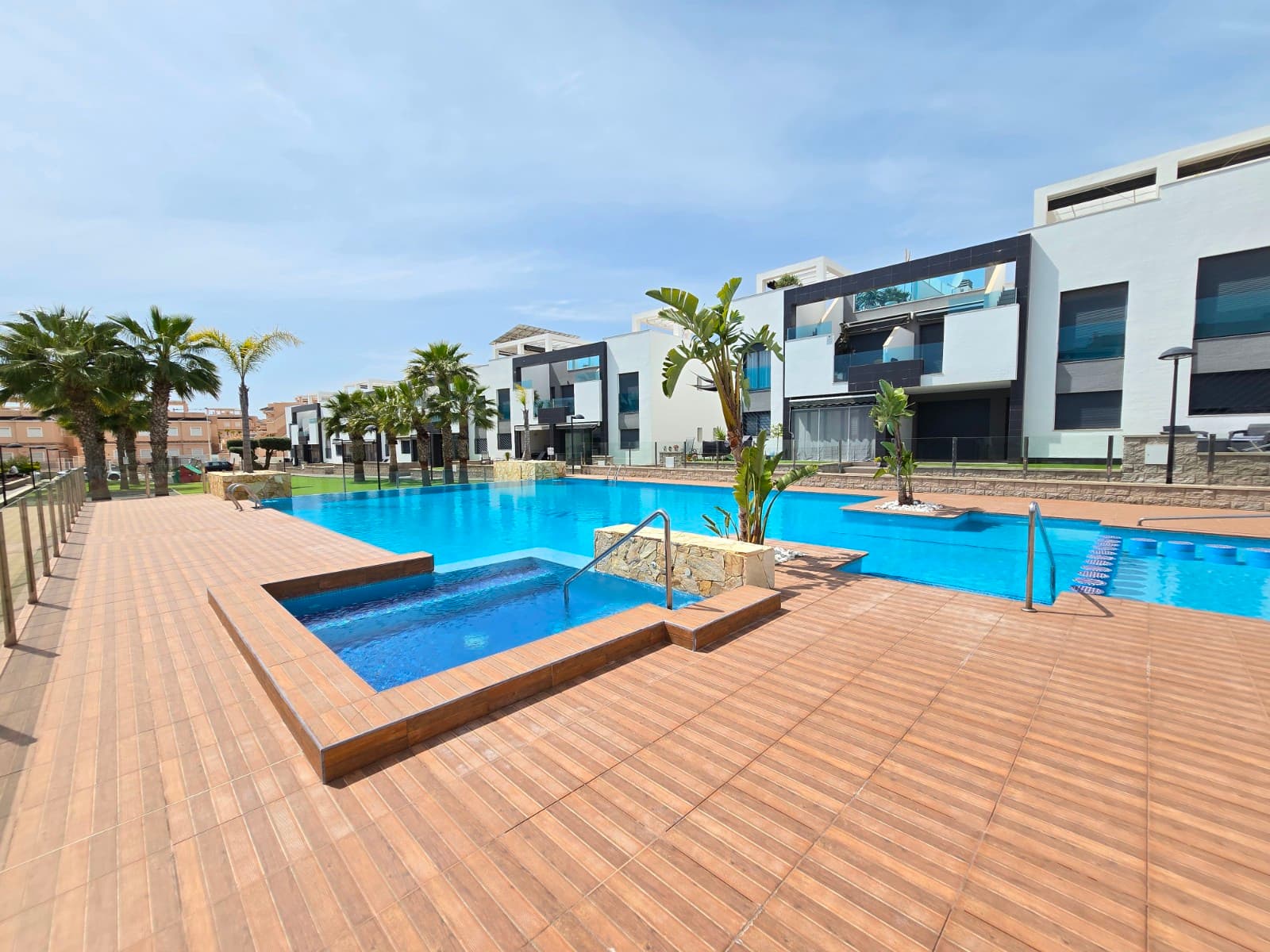 Discover this beautiful, move-in-ready ground-floor apartment located in the popular Punta Prima, within walking distance of the beach, lively bars, restaurants and a variety of shops. The ideal combination of comfort, location and quality of life on the Costa Blanca.The property features 2 spacious bedrooms and 2 modern bathrooms, perfect for both permanent residence and holiday use. The open-plan, fully equipped kitchen flows seamlessly into the light-filled living area, creating a pleasant, modern living experience. There is also a practical storage room.For optimal comfort, the apartment is fitted with air conditioning and infrared heating, making it a pleasant place to stay all year round.Outside, you can enjoy a sunny terrace and a covered terrace with sliding windows, ideal for relaxing in any season. The apartment is sold fully furnished, allowing you to move in or let it out immediately.The property also features a private garage space.Situated in a well-maintained residential complex, this development offers additional amenities such as a communal swimming pool and a pétanque court, perfect for relaxation and socialising.In short, a unique opportunity to enjoy a modern home in a prime seaside location!SUMA: 210 euros per year.Community costs: 850 euros per year.
