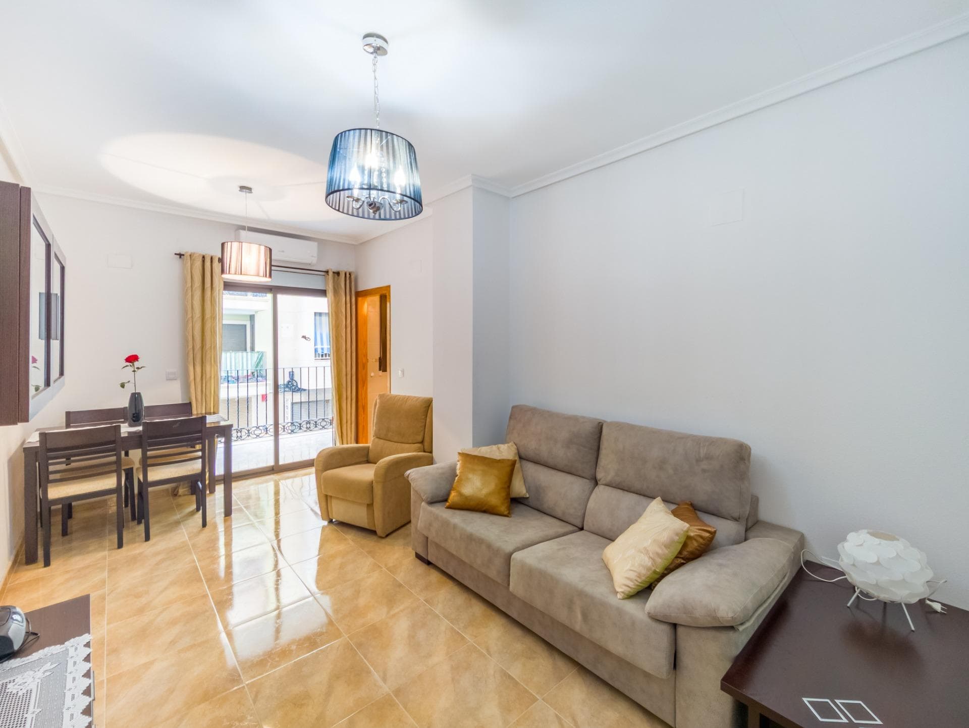 Introducing this cozy apartment in Torrevieja, located in the sought-after Acequión neighborhood—just 100 meters from Los Náufragos and Acequión beaches. Torrevieja is a vibrant coastal city on Spain’s Costa Blanca, renowned for its year-round sunshine, stunning beaches, and lively yet relaxed Mediterranean lifestyle. The apartment is situated on the first floor of a secure, gated residential complex and enjoys an excellent south-facing orientation, maximizing natural light throughout the day. Its layout is both practical and comfortable: a spacious, bright living room flows seamlessly into the dining area, with direct access to a sunny south-facing terrace. The terrace features a cozy outdoor seating area with table and chairs—perfect for enjoying warm mornings, afternoon sun, and pleasant views of the surroundings. It includes two move-in-ready bedrooms, each fitted with built-in wardrobes and fully furnished, along with two modern, fully equipped bathrooms designed for comfort and convenience. Located in a central and well-connected area of Torrevieja, everything you need is within walking distance: Supermarkets, pharmacies, and medical centers (including the modern Torrevieja University Hospital) Schools and institutes for all age groups The scenic Parque de las Naciones and the seaside promenade—ideal for family strolls or morning jogs The Habaneras Shopping Centre, featuring shops, cinemas, restaurants, and entertainment—all just a few minutes’ walk away Torrevieja is more than a holiday destination—it’s a thriving city for year-round living. With ongoing investments in infrastructure—including new schools, sports complexes, residential developments, and public services—it continues to grow while maintaining its charm. Thanks to its mild climate, beautiful coastline, and international community, Torrevieja offers an exceptional quality of life. This apartment is an ideal choice for permanent residence, retirement, or a smart investment in a high-demand rental market.