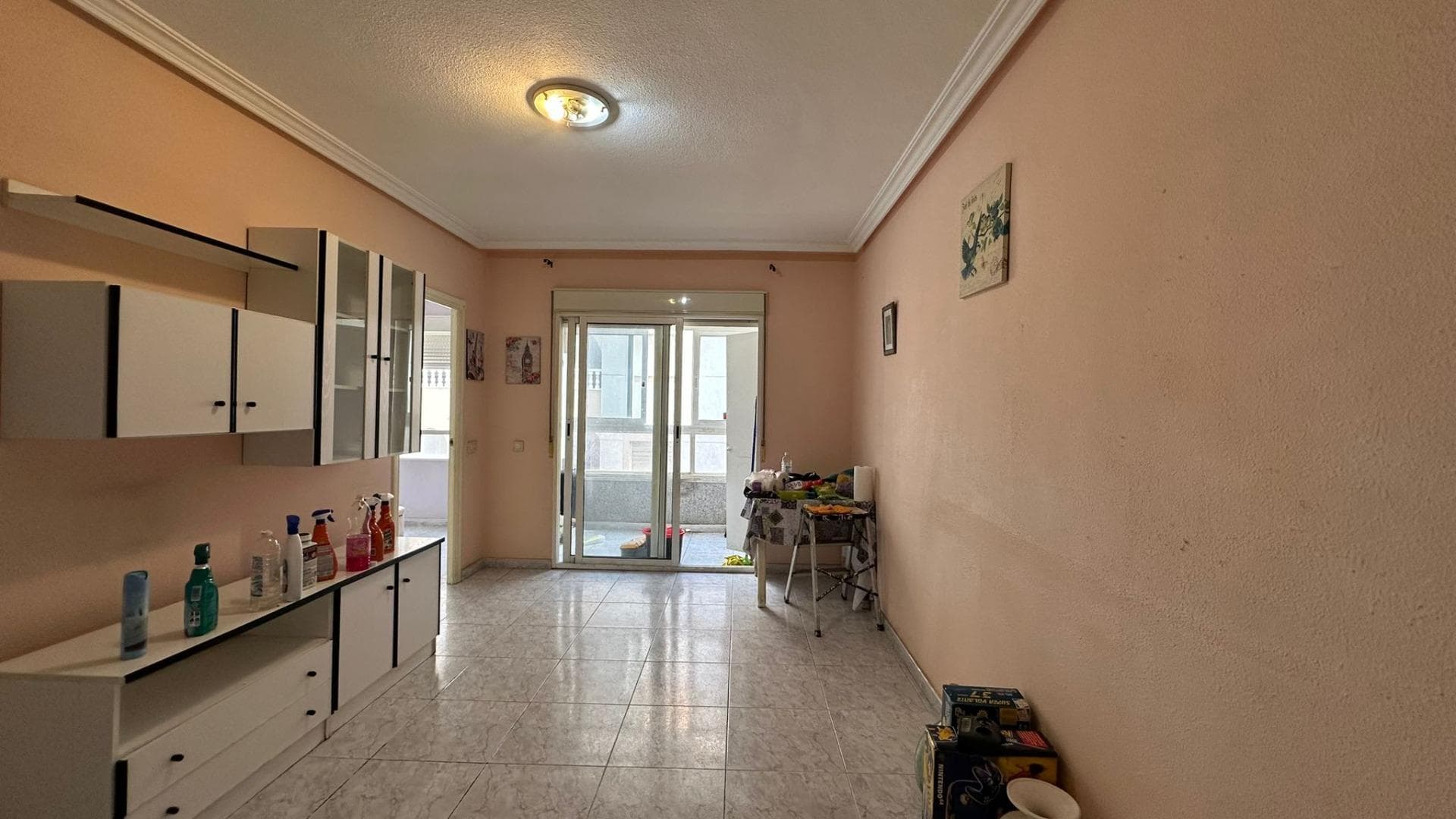 Discover a unique opportunity in the heart of Torrevieja, a city that perfectly blends Mediterranean charm with a vibrant year-round lifestyle. This apartment represents much more than just a home: it's an open door to creating the home you've always imagined, perfectly tailored to your lifestyle, tastes, and needs. Located right in the city center, living here means having absolutely everything at your fingertips. From the moment you set foot in this area, you'll feel the energy of a lively city, where every street tells a story and every corner offers something different. Strolling along its avenues, enjoying its terraces, discovering small local shops, or simply soaking up the atmosphere are all part of the daily experience offered by this prime location. This apartment is ideal for those seeking more than just a finished property. It's perfect for those who want to design their own space from scratch, create a fully personalized home, and make the most of every corner according to their own vision. Here, there are no limits, only possibilities. Each room can be transformed into whatever you desire, allowing you to create a unique space that reflects your personality and lifestyle. Imagine waking up every morning in a light-filled environment, stepping outside, and having everything you need just steps away. From supermarkets, shops, cafes, and restaurants to essential services, everything is designed to make your daily life comfortable and convenient. Living in the heart of Torrevieja means forgetting about your car and enjoying a much simpler and more accessible lifestyle. Furthermore, the proximity to the sea makes this property an even more attractive option. Feeling the sea breeze, strolling along the promenade, or enjoying sunsets over the Mediterranean are small luxuries that become part of everyday life here. The quality of life offered in this area is hard to match, combining tranquility and dynamism in perfect balance. This apartment is also an excellent opportunity for investors. Its strategic location makes it an asset with enormous potential for appreciation. Demand in the center of Torrevieja is constant, both for rentals and sales, guaranteeing a solid investment with long-term potential. Whether for holiday rentals, long-term stays, or resale after renovation, the possibilities are vast and very appealing. Renovating this property isn't a drawback, but rather a significant advantage. It allows you to completely adapt the space to current trends, optimize the layout, and create a modern, functional, and attractive environment. Instead of paying for a renovation that might not suit your style, here's the opportunity to do it your way, with the design and finishes you truly desire. Imagine an open, bright space with a contemporary design, quality materials, and meticulous details. Or perhaps you prefer a warmer, more inviting style with traditional touches and a tranquil atmosphere. Anything is possible. This apartment is a blank canvas where you can shape your ideal project. Living in the city center also offers a great social advantage. You'll be surrounded by activity, events, culture, and leisure. You can enjoy a wide range of dining options, from traditional restaurants to more modern establishments. The entertainment options are endless, making every day a new opportunity to enjoy. Furthermore, Torrevieja is a city with an international character, which adds extra value to the property. People from all over the world choose this city to live or invest, creating a very enriching multicultural environment. This also translates into higher real estate demand, further reinforcing the value of this opportunity.