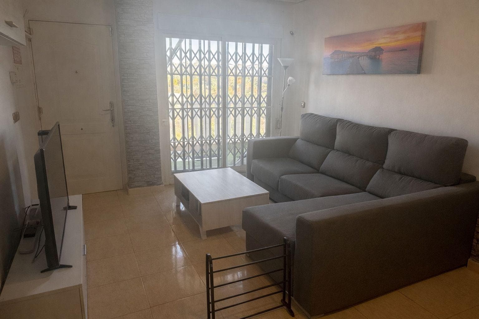 A magnificent opportunity has arisen to purchase an exclusive penthouse situated in the prestigious Lomas de Cabo Roig area, one of the most sought-after residential areas on the Orihuela Costa. Located at the top of the N-332 national road, this setting offers an ideal combination of tranquillity, privacy and excellent links to the main towns and amenities in the area. The property’s location is particularly noteworthy, being approximately two and a half kilometres from the sea, allowing you to enjoy the proximity of the beaches without sacrificing a more relaxed and less crowded residential environment. This feature makes Lomas de Cabo Roig a highly sought-after area for both permanent residents and those seeking a second home on the Mediterranean coast. The south-facing penthouse enjoys excellent natural light throughout the day, benefiting from optimal sun exposure that brings warmth and comfort to the interior spaces. This orientation is particularly sought-after in the property market, as it maximises the use of natural light and improves the home’s energy efficiency. In terms of layout, the property features two bedrooms, both of a suitable size and designed to offer comfort and functionality. These spaces are ideal for both rest and adaptation to different needs, whether as master bedrooms, guest rooms or even as a home office for remote working. The full bathroom, well-maintained and equipped, has a practical layout that meets the demands of daily use. The penthouse forms part of a residential community featuring a communal swimming pool, a feature that adds significant value to the property. This communal space offers an ideal setting for leisure and relaxation, particularly during the warmer months, allowing residents to enjoy the Mediterranean climate in a well-maintained and pleasant environment. In addition to its interior features, the fact that it is a penthouse adds an extra touch of exclusivity, offering greater privacy, better views and a general sense of spaciousness. This type of property is particularly sought after by those who value peace and independence within a residential setting. The Lomas de Cabo Roig area also stands out for its proximity to a wide range of amenities, including supermarkets, restaurants, shopping centres, sports facilities and golf courses, ensuring an excellent quality of life. Furthermore, its good connections to other nearby towns and its accessibility make this location a strategic spot along the Alicante coast. Overall, this penthouse represents a highly attractive opportunity as a primary residence, holiday home or property investment, thanks to its prime location, south-facing aspect, functional layout and the amenities offered by the community in which it is situated. In short, this is a property that combines location, comfort and potential, ideal for those seeking to enjoy the Mediterranean lifestyle in an exclusive and well-established setting.