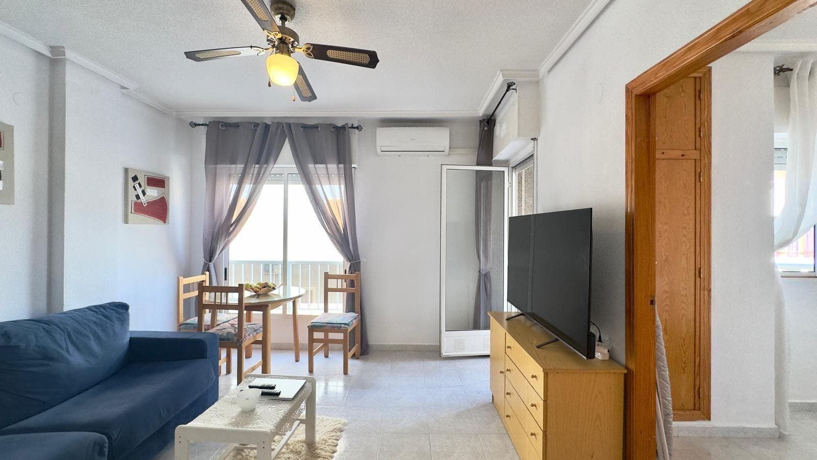 An excellent opportunity has been presented to acquire a first-floor apartment located in the established and sought-after area of ​​La Acequión, in Torrevieja. This enclave stands out for its proximity to the sea, its residential atmosphere, and its closeness to all the necessary amenities for daily life, making it one of the most highly valued areas for both permanent residents and those looking for a second home on the coast. The property enjoys a privileged southern orientation, a particularly prized feature in the real estate market, as it guarantees excellent natural light throughout much of the day. This characteristic not only provides a greater sense of spaciousness and warmth in the interior spaces but also contributes to improved energy efficiency and overall comfort. The apartment has a functional and balanced layout, with two well-sized bedrooms designed for comfort and versatility. These spaces can be easily adapted to different needs, whether as master bedrooms, additional rooms, or even as an office, which adds practical value to the property. The property also features a fully equipped bathroom in good condition, with all the necessary amenities for comfortable and efficient use. The home is generally move-in ready, a significant advantage for buyers who wish to avoid renovations or additional investment. One of the main attractions of this property is its exceptional location just 250 meters from the sea, allowing you to enjoy the beach in just a few minutes' walk. This proximity makes the property an ideal option for those who want to integrate the Mediterranean lifestyle into their daily routine, making the most of the coastal environment. Additionally, the property includes a parking space and a storage room, two elements that provide considerable added value. The parking space guarantees convenience and security, especially in an area where parking demand can be high. The storage room, meanwhile, offers extra storage space, facilitating home organization and helping to keep the main living areas more uncluttered. The La Acequión area is characterized by its excellent connections to the rest of the city, as well as its proximity to supermarkets, restaurants, medical centers, pharmacies, public transport, and all kinds of services. This combination of location, accessibility, and amenities makes the property a highly competitive option in today's real estate market. Overall, this property boasts a number of highly valued features: south-facing orientation, proximity to the sea, move-in ready condition, included garage and storage room, and a strategic location in one of Torrevieja's most sought-after areas. This property, therefore, represents an ideal opportunity as a permanent residence, holiday home, or investment with high profitability potential, offering an excellent balance of quality, location, and amenities.