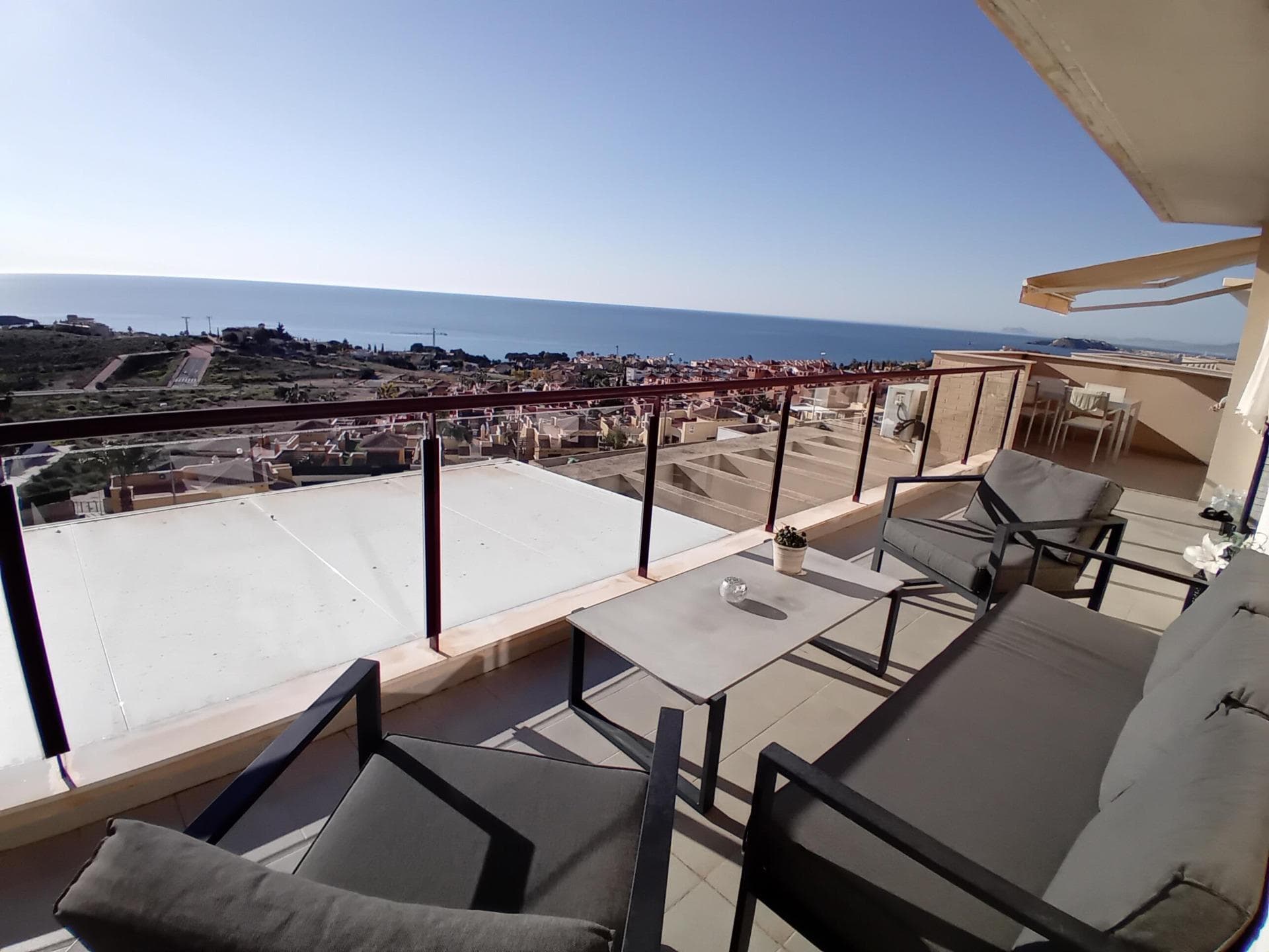 Perched at the very top of the sought-after Mojon Hills resort in Isla Plana, this exceptional two-bedroom apartment enjoys a truly commanding position with uninterrupted panoramic views across Isla Plana and the Costa Cálida coastline. Elevated, open, and bathed in natural light, the outlook alone sets this property apart. Built in 2010, the apartment offers a spacious and well-designed layout comprising two generous bedrooms and a modern family bathroom. It is sold fully furnished and equipped, with quality appliances throughout, allowing for immediate use either as a private residence or an income-generating investment. Hot and cold air conditioning ensures year-round comfort, while high-speed internet makes the property equally suitable for longer stays or remote working. Residents benefit from access to a well-maintained communal swimming pool and landscaped communal areas, all supported by very low community fees of just €50 per month. The property also includes an allocated parking space within the community, with additional ample parking available outside for guests. The elevated position not only guarantees privacy and views, but also makes this apartment highly attractive for holiday rentals. The property has a proven rental history, achieving nightly rates from approximately €100 in low season up to €250 during peak summer months, offering excellent potential returns. Whether you are seeking a lock-up-and-leave holiday home, a permanent residence with views, or a ready-made rental business, this apartment truly ticks every box. Opportunities in this prime position are limited. Contact us today to arrange a viewing and experience the views, space, and potential of this outstanding Mojon Hills apartment for yourself.
