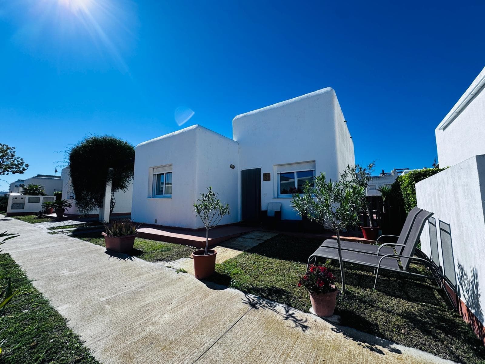 Villa Jana is a detached 2-bedroom, 2-bathroom villa in the much sought after Condado de Alhama Golf Resort in Murcia. Set on a private plot, it features a bright open-plan interior, modern kitchen, and air conditioning, designed for comfortable Mediterranean living. The property includes a private garden for outdoor dining and relaxation and access to a communal swimming pool. Located within a gated community with 24-hour security, the villa benefits from onsite amenities including shops, restaurants, sports areas and the Jack Nicklaus-designed golf course. It’s ideal as a permanent home, holiday residence or investment with strong rental appeal, and is about 20 minutes from Mediterranean beaches. The resort is approximately one hour and 15 minutes drive from Alicante International Airport and 35 minutes from Región de Murcia International Airport.