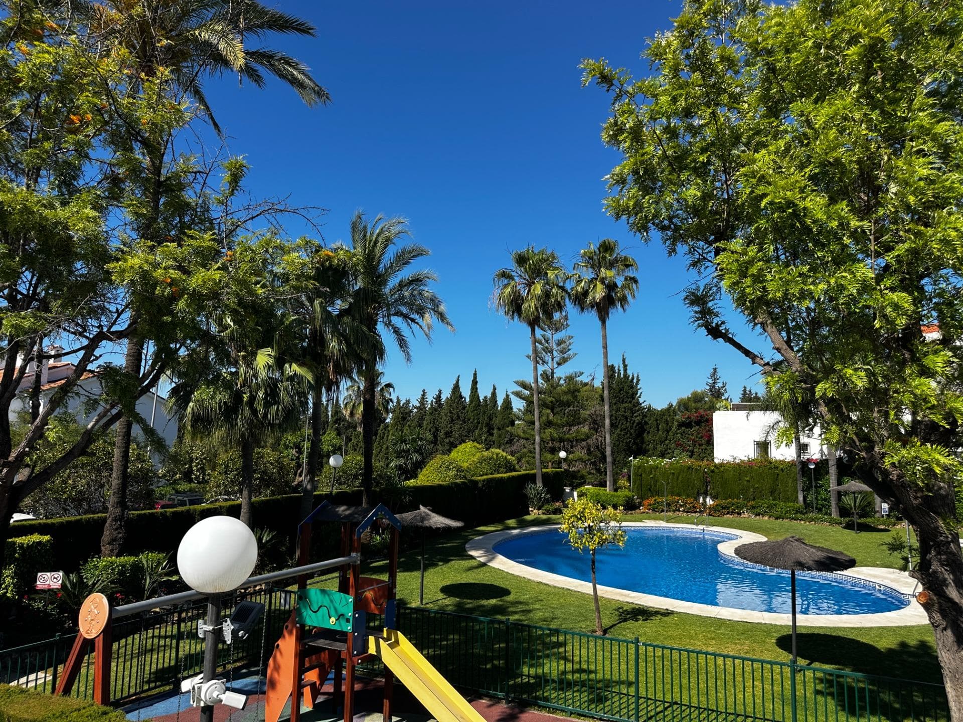 Discover this stunning semi-detached home located in the prestigious gated community of Cumbres de Marbella, nestled in the hills just above the iconic Golden Mile. Offering a perfect blend of peace, privacy, and 24/7 security, this highly sought-after residential area places you just minutes from both Marbella’s vibrant town center and the luxury of Puerto Banús. Designed with families in mind, the villa stands out for its exceptional brightness, spacious layout, and premium lifestyle amenities. While currently configured as a massive 3-bedroom home, it can easily be converted back to its original 4-bedroom layout depending on your needs. Main Floor: A sleek, enclosed entrance porch with stylish Lumon glass curtains opens into a guest restroom, a fully renovated modern kitchen, and an expansive living and dining area. From here, step out onto a large private terrace—your ultimate outdoor lounge for year-round dining. First Floor: Two generous guest suites, each boasting its own private bathroom for total comfort. Top Floor: The spectacular master suite features an en-suite bathroom and seamless access to a magnificent rooftop terrace, serving up panoramic views of the Mediterranean Sea and Marbella’s iconic La Concha mountain. Eco-Friendly & Smart Extras: Equipped with advanced solar panels for hot water, the property offers major energy efficiency and low electricity costs. The home also includes private indoor garage parking. The Community: The exclusive urbanization features beautifully manicured grounds, a large swimming pool, a separate children's pool, a playground, a paddle tennis court, and full video surveillance for absolute peace of mind. With international school bus stops and transport links right on your doorstep, this is a rare, high-potential opportunity in one of Marbella’s most exclusive neighborhoods.