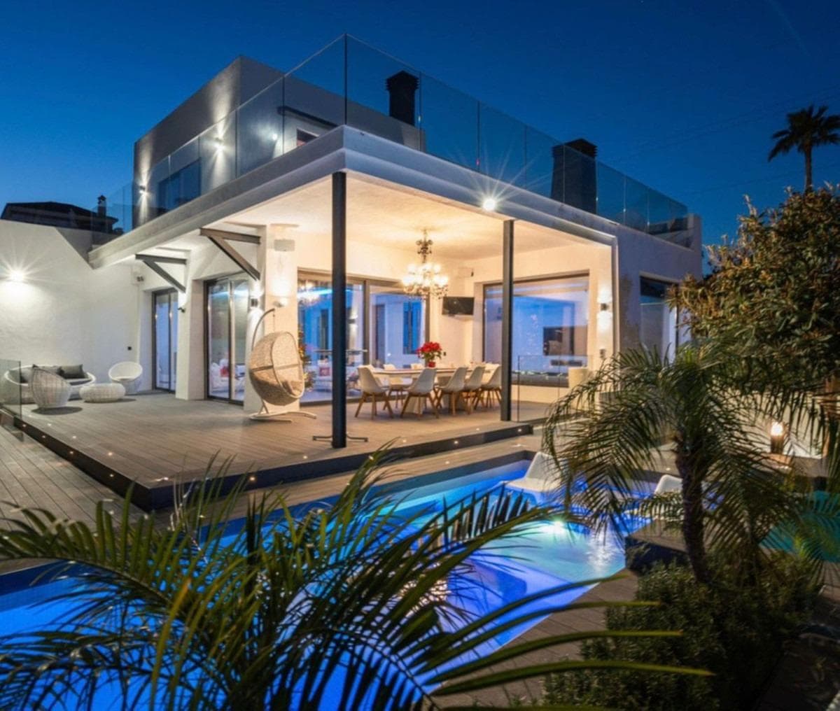 Situated in the heart of Nueva Andalucía, this exceptional eight-bedroom contemporary property offers complete privacy, vast living spaces, and quick access to top-tier golf courses and Puerto Banús. Set on an expansive 1,890 m² plot, the residence comprises 1,100 m² of meticulously built interiors paired with 300 m² of open terraces. Designed to maximize indoor-outdoor integration, the floor plan flows effortlessly through two spacious living areas lined with floor-to-ceiling windows that open directly onto beautifully landscaped gardens. The residence comes fully furnished and is thoughtfully equipped for seamless modern living across multiple levels, all connected by a private elevator that offers direct access to a secure underground garage. Featuring 11 bathrooms and an impressive outdoor layout that includes three private swimming pools, this turnkey home provides an unparalleled environment for large-scale entertaining or tranquil family retreats. For full commercial specifications, please contact us directly.