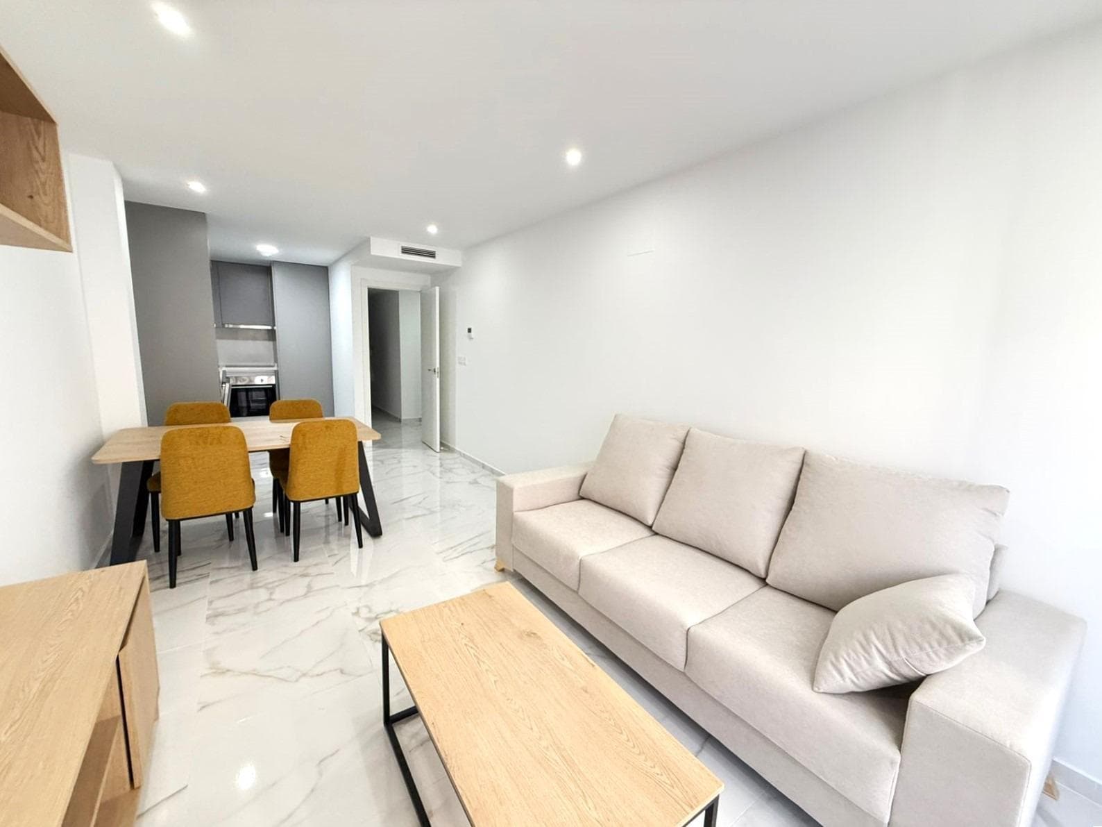 Modern 2-bedroom flat with balcony, sauna and barbecue area in Torrevieja RENT WITH OPTION TO BUY. 50% DOWN PAYMENT. TOTAL PRICE: €210,000. This newly built modern flat, located on the first floor of a contemporary building, is ready to move into. With a functional and elegant design, it has 2 spacious bedrooms and 2 complete bathrooms, designed to offer comfort and privacy. The day area is composed of a bright living room with direct access to a pleasant balcony, perfect to take a breath of fresh air or enjoy a cup of coffee. The integrated and modern kitchen is connected to the main space, creating a comfortable and practical environment. In addition, the flat has an interior courtyard that provides natural light and additional ventilation. Among its quality features, the underfloor heating system provides a comfortable temperature all year round. But what really makes this flat special are the communal areas: on the top floor of the building there is an exclusive wellness area with sauna and a barbecue area, ideal for relaxing or sharing moments with friends and family. LOCATION: Torrevieja is in the province of Alicante (Costa Blanca). It is famous for its Mediterranean climate and its coast. We cannot forget its promenades where we can find some restaurants along the fine sandy beaches. It also has many excellent beaches such as Playa de los Náufragos, Playa de los Locos and Playa de la Mata. Therefore, it is considered a remarkable tourist town where the environment takes an important place as an important tourist attraction. In addition, we can find many shopping centres (Habaneras, La Zenia Boulevard), golf courses, sport centres, hospitals (such as Hospital Universitario de Torrevieja) and airports such as Alicante Airport (35 km away) and Region of Murcia International Airport (43 km away). DISTANCE TO THE SEA: 700m Should you have any question do not hesitate to contact us!
