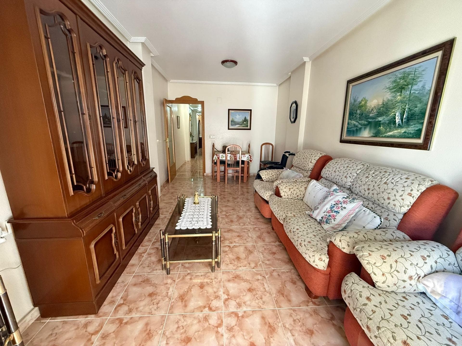 2-bedroom apartment with a terrace and side sea views in Torrevieja Just 100 meters from the sea, in the sought-after Playa del Cura neighborhood, lies this cozy, move-in-ready apartment—ideal both as a primary residence and for enjoying getaways by the Mediterranean. The apartment, located on the second floor of a building with an elevator, offers 73 m² of perfectly laid-out space. It features two bright bedrooms, a full bathroom, and a separate kitchen that provides comfort and functionality for everyday living. The living-dining room opens onto a pleasant terrace where you can relax while enjoying side views of the sea and the gentle sea breeze. It is sold fully furnished, allowing you to move in right away without the need for additional investments. LOCATION: Torrevieja is in the province of Alicante (Costa Blanca). It is famous for its Mediterranean climate and its coast. We cannot forget its promenades where we can find some restaurants along the fine sandy beaches. It also has many excellent beaches such as Playa de los Náufragos, Playa de los Locos and Playa de la Mata. Therefore, it is considered a remarkable tourist town where the environment takes an important place as an important tourist attraction. In addition, we can find many shopping centres (Habaneras, La Zenia Boulevard), golf courses, sport centres, hospitals (such as Hospital Universitario de Torrevieja) and airports such as Alicante Airport (35 km away) and Region of Murcia International Airport (43 km away). DISTANCE TO THE SEA: 100m Should you have any question do not hesitate to contact us!
