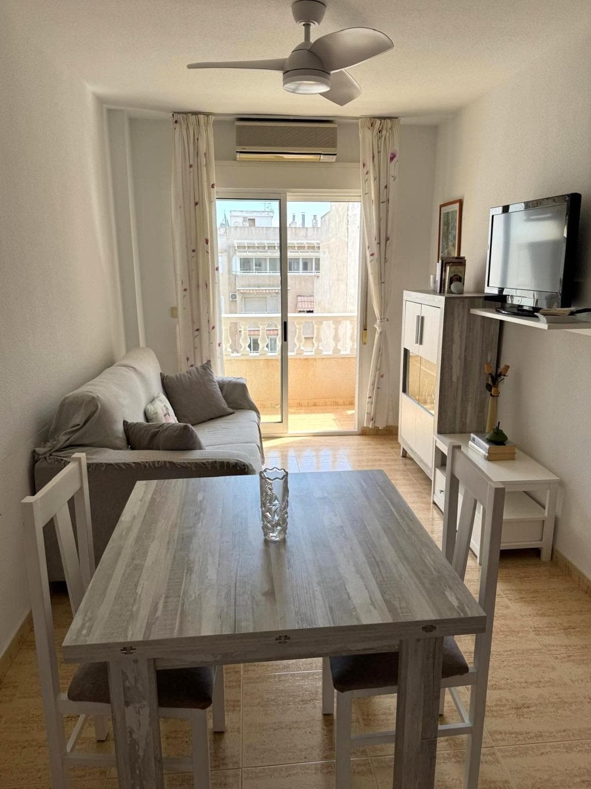 Bright 1-bedroom penthouse with a terrace, 200 meters from Acequión Beach South-facing penthouse just 200 meters from Acequión Beach—an ideal opportunity to enjoy the sun and sea all year round. Located on the fifth floor with elevator access, it offers privacy, plenty of natural light, and pleasant, unobstructed views. The apartment features 69 m² of well-distributed space, with one bedroom, a full bathroom, and a cozy living room that opens onto a sunny terrace—perfect for relaxing, having breakfast outdoors, or enjoying Mediterranean evenings. Thanks to its excellent south-facing orientation, natural light floods every room, creating a warm and comfortable atmosphere. Its proximity to the beach, along with all amenities just a short walk away, makes it an ideal choice as a primary residence, second home, or investment property. LOCATION: El Acequión is located in Torrevieja (Alicante), on the Costa Blanca. It is known for its typically Mediterranean climate and coastline. It is worth mentioning its promenades with several places along its fine sandy beaches, among which are the Playa de los Náufragos (600 m away) and the Playa de los Locos (3 km away). In addition, we can find several shopping centres such as Habaneras (3 km away) or La Zenia Boulevard (7 km away), golf courses, sports centres, health centres such as Torrevieja II El Acequión (800 m away), hospitals such as the University Hospital of Torrevieja (4 km away) and airports such as Alicante (35 km away) and the International Airport of the Region of Murcia (43 km away). DISTANCE TO THE SEA: 200 m Should you have any question do not hesitate to contact us!