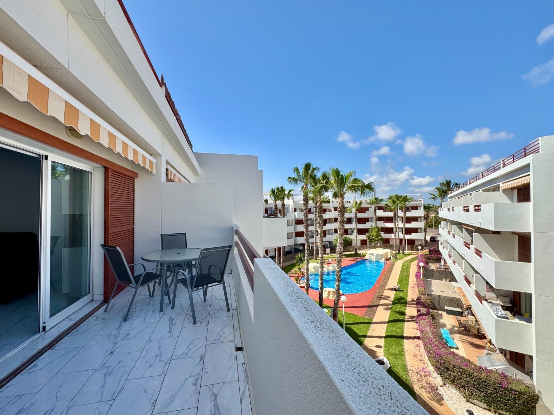 beautifully renovated penthouse in a prime location, just 500 metres from the beach. located in the heart of orihuela costa, this stunning south-west facing penthouse offers the perfect blend of comfort, style, and mediterranean living. fully renovated throughout, the property features two spacious bedrooms, two modern bathrooms, and a bright open-plan living area with lovely views over the communal pool. the contemporary american-style kitchen flows seamlessly into the living space, while a separate utility room adds everyday practicality. one of the standout features is the impressive 65 m² private solarium, where you can enjoy all-day sunshine, beautiful sea views, and the ideal setting for relaxing, entertaining, or dining under the stars. set within a well-maintained residential community, residents can enjoy beautifully landscaped gardens with mature trees, as well as two communal swimming pools. the property also includes a covered parking space. with supermarkets, bars, and restaurants all within easy reach, and alicante airport just 45 minutes away, this is an exceptional opportunity to own a stylish coastal home in one of the most sought-after areas of the costa blanca. fully renovated, perfectly located, and ready to enjoy.