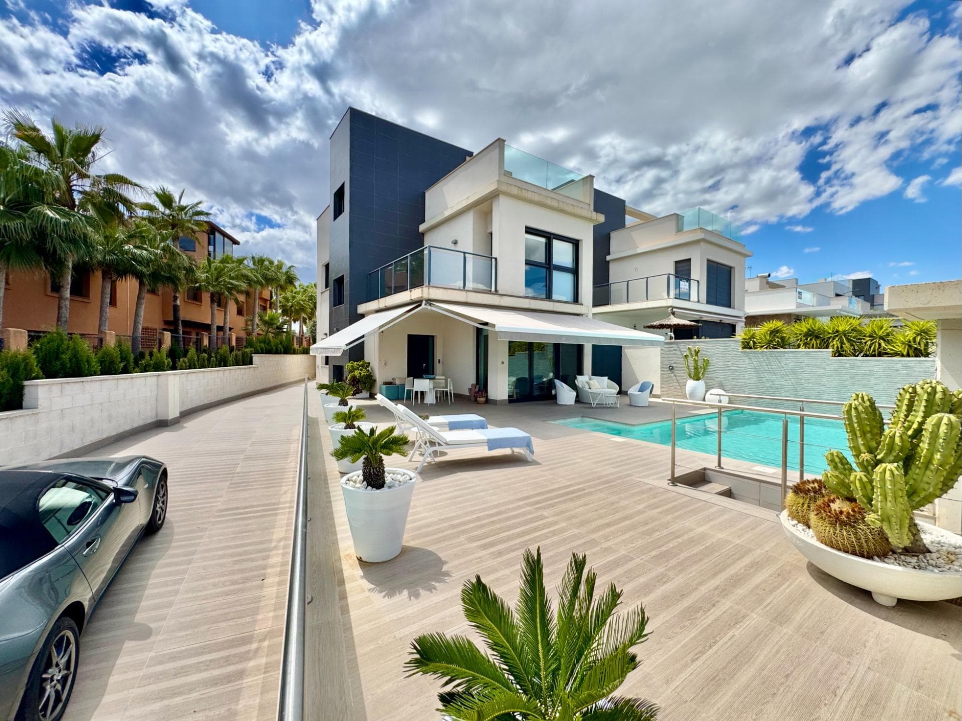 stylish villa with partial sea views. this beautiful villa is situated on a 350 m² plot and offers approximately 250 m² of built area, where space, comfort and contemporary living blend together beautifully. the property features 4 spacious bedrooms and 3 elegant bathrooms, with the possibility to create additional bedrooms, making it perfectly suited as a permanent residence, holiday home or investment opportunity. on the ground floor, there is a bright and inviting open-plan living area with an integrated kitchen that connects seamlessly to the outdoor spaces and the backyard. this floor also includes a spacious bedroom and a bathroom. the first floor offers three additional bedrooms and two bathrooms. the master bedroom features a stylish en-suite bathroom and a private terrace with beautiful sea views, creating a peaceful place to relax and enjoy the surroundings. on the top floor, you will find the spacious solarium with jacuzzi, ideal for relaxing and enjoying the sun, privacy and open views. an additional highlight is the generous basement level extending underneath the entire property, offering countless possibilities such as a relaxation area, gym, home cinema, hobby room or additional living space. creating extra bedrooms is also possible. in terms of comfort, the villa is equipped with aerothermal underfloor heating throughout the entire home and a heated swimming pool for optimal enjoyment all year round. outside, the villa also offers plenty of space, including a beautiful front terrace, a pleasant backyard, practical storage space and private parking for multiple vehicles. a stylish home where comfort, functionality and refined mediterranean living come together harmoniously.