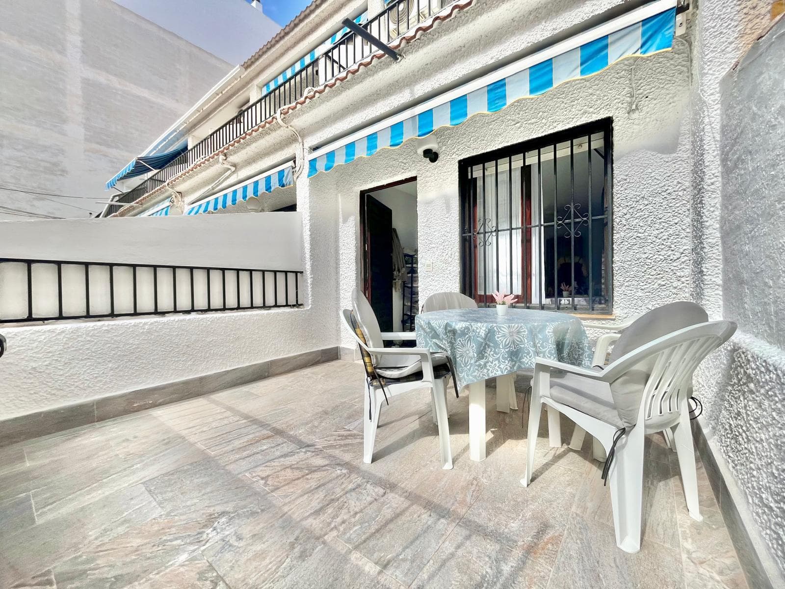 Duplex Penthouse with Terrace and Two Balconies Just 5 Minutes from the Beach Beautiful duplex penthouse located in an excellent area of Torrevieja, just a 5-minute walk from both Los Locos Beach and El Cura Beach, two of the city's most popular beaches, known for their sandy shores, seafront promenades, restaurants, cafés, and vibrant year-round atmosphere. The property stands out for its outdoor spaces, featuring a spacious entrance terrace, perfect for enjoying the Mediterranean climate and outdoor living, as well as two additional balconies that provide plenty of natural light and ventilation throughout the home. Access to the property is through the terrace, leading directly into a bright and welcoming living room. On this floor, you will also find an independent kitchen with newly installed flooring, a guest toilet, and a balcony accessed from the kitchen area. The upper floor offers two generously sized bedrooms. The master bedroom benefits from air conditioning and direct access to a private balcony. This level also features a large, fully renovated bathroom. The property has been significantly improved over the last year, including a complete bathroom renovation, new kitchen flooring, a full electrical system upgrade throughout the home, and fresh interior painting. Another major advantage is that there are no community fees, providing significant annual savings and greater independence for the owner. An excellent opportunity as a permanent residence, holiday home, or investment property in one of Torrevieja’s most sought-after locations. Ready to move into and enjoy from day one.