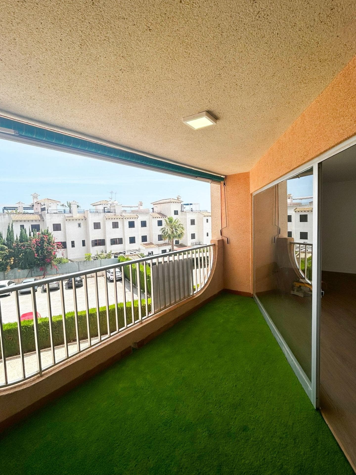Exclusive Apartment in La Zenia, Just a 10-Minute Walk from the Beach We are pleased to present this magnificent property located in one of the most sought-after areas of La Zenia. An exceptional opportunity for those looking to enjoy the Mediterranean lifestyle in a privileged setting, with all essential amenities within easy reach and the beach just a 10-minute walk away. The apartment features 3 spacious bedrooms and 2 full bathrooms, offering a comfortable and functional layout, ideal as a permanent residence, holiday home, or investment property. The kitchen comes fully furnished and equipped with appliances, ready to move into. One of the property's standout features is its inviting terrace, fitted with artificial grass and an awning, creating the perfect space to enjoy the Costa Blanca’s wonderful climate all year round. From here, you can enjoy pleasant views of the communal swimming pool and the sea, providing a peaceful and relaxing atmosphere. The property is part of a well-maintained residential complex with a communal swimming pool and a private parking space. In addition, the building has recently undergone renovation works, including the refurbishment of its façade, adding both aesthetic appeal and long-term value. Its excellent location allows easy walking access to a wide range of restaurants, cafés, supermarkets, shops, and leisure facilities, making it an ideal choice for those seeking convenience and quality of life close to the sea. Whether you are looking for a year-round residence, a holiday retreat, or a smart investment opportunity, this property offers everything that makes La Zenia one of the most desirable destinations on the Costa Blanca. A unique opportunity to enjoy Mediterranean living, sea views, and a prime location in La Zenia.