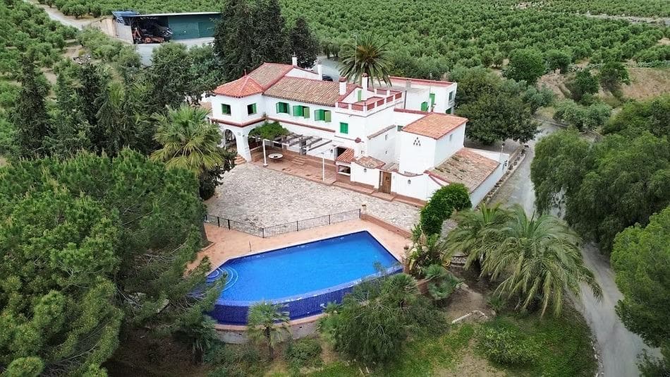 For Sale: An exclusive certified organic agricultural estate located in the Murcia region, with excellent access from the A-7 and A-91 motorways. A unique opportunity for agricultural investment, rural tourism development, or a high-value private residence.. . **Key Features:**. • 57 hectares of irrigated organic olive groves (Arbequina variety).. • Annual production of up to 450,000 kg of olives (equivalent to approx. 90,000 liters of organic olive oil).. • Certified by CAERM for organic production and direct sales (potential to create and market your own brand).. • 99 hectares of reforested Mediterranean forest — ideal for environmental projects, rural tourism, or carbon credit initiatives.. • Traditional country house of approx. 750 m2, full of rustic charm — perfect as a private residence, rural hotel, or boutique retreat.. • Own water resources: reservoirs, irrigation systems, and energy autonomy.. • Fully equipped with agricultural machinery, infrastructure, and internal access roads.. . **Investment Potential:**. • Sale of organic olive oil to gourmet markets (higher profitability than conventional).. • Development of a D2C brand, premium oil subscription model, and online shop.. • Agrotourism, wine tourism, and culinary experiences.. • Rural hotel, wellness retreat, or luxury private villa.. • Eligible for European grants and tax benefits for organic production and sustainable forest management.. . **Why It’s a Unique Opportunity**:. • A tangible and secure asset with water and productive land.. • Prime location with an ideal climate for olive cultivation.. • A turnkey project — ready to operate immediately..