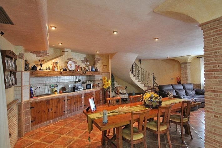 Discover this stunning villa located on one of the main streets of Formentera del Segura. This corner home stands out for its brightness and elegant design, built with high-quality materials. Upon entering, you’ll be greeted by a spacious dining room adorned with brick columns and a cozy fireplace that flows seamlessly into the open-concept kitchen with a breakfast bar. This rustic villa combines tradition and comfort in every detail; it also features ducted air conditioning, ensuring optimal temperatures year-round. Natural light floods the spaces, creating a warm and inviting atmosphere. On the ground floor, you’ll find two comfortable bedrooms next to a spacious bathroom. From the dining room, you’ll have direct access to a rustic kitchen with an outdoor barbecue area. There’s a charming terrace where you can enjoy your private pool and a relaxation area—perfect for unwinding and soaking up the Mediterranean climate. It has enough space to set up your own personal gym. On the first floor, there are three spacious, elegantly decorated double bedrooms, plus a full bathroom equipped with a modern double sink, screened by glass panels that offer privacy without sacrificing natural light. A garage with space for two vehicles, plus a dedicated storage area, makes this property perfect both as a comfortable family home and as a potential investment due to its strategic location near essential services. The town preserves ancient traditions, adding to its authenticity, while remaining quiet, safe, and surrounded by friendly people. It also offers excellent connections to major cities such as Elche and Alicante. The beach is just minutes away, making it the perfect place to live and enjoy a high quality of life. The airport is only 30 minutes away. It has everything you need for a full and fulfilling life.