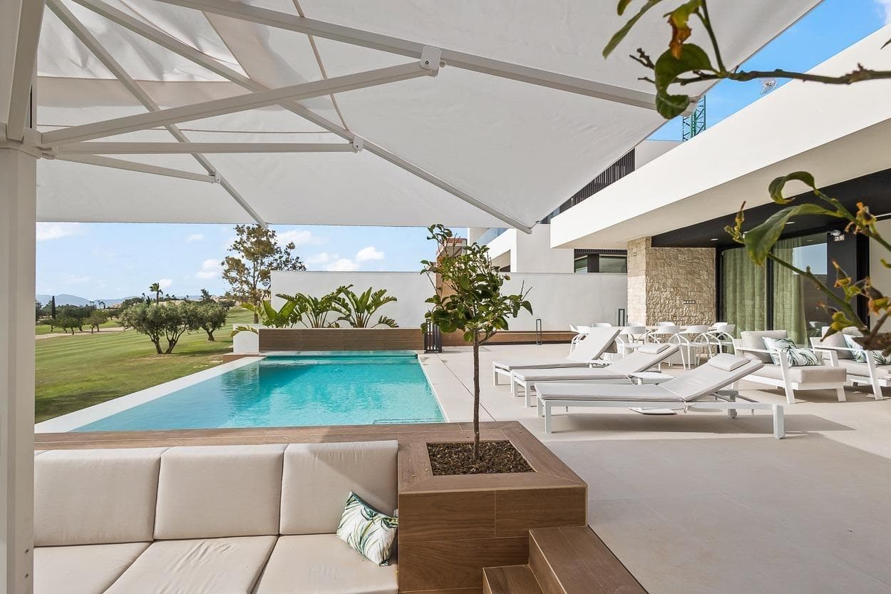 5-bedroom villa with large semi-basement on the frontline of the golf course for sale in Algorfa. A Modern Masterpiece in the Heart of the Costa Blanca Experience the finest in Mediterranean living with this newly 2024 built, frontline golf villa set within the exclusive La Finca Golf Resort in Algorfa.  Designed with impeccable attention to detail, this exceptional home blends elegant contemporary design with high-end functionality, creating the perfect balance between style, space, and serenity. Key Features: Prime Frontline Golf Position – Private & direct views over the fairways of La Finca Golf Course 5 Spacious Double Bedrooms & 4 Bathrooms Self-Contained 3-Bedroom Guest Apartment with private kitchen and independent access Private Lift – Connecting all levels for easy, step-free access Wheelchair-Friendly Design – Wide hallways, generous doorways, and barrier-free living areas Designer Kitchen with top-of-the-line Siemens appliances Underfloor Heating Throughout Smart Home Automation System Private Infinity Swimming Pool with electric pool cover and chill-out zone Fully Landscaped Mediterranean Garden Underground Garage for 2 Vehicles High-Speed Internet – Indoors & Outdoors Advanced Alarm & Video-Controlled Security System Layout & Design: This elegant villa is distributed over two floors: Main Floor: Open-plan living area, premium kitchen, master suite with walk-in wardrobe, additional bedrooms, and access to poolside terrace Ground Floor: Separate 3-bedroom apartment, ideal for guests, extended family, or luxury rentals Garage: Underground parking for 2 cars, laundry area, and storage Crafted with modern architecture and floor-to-ceiling windows, the home captures natural light and seamlessly connects indoor and outdoor living.  The Location – La Finca Golf Resort, Algorfa: Located near the charming town of Algorfa, in the heart of the Vega Baja, this villa offers an exceptional lifestyle surrounded by nature, golf, and Mediterranean tradition. The area is renowned for its citrus groves, relaxed atmosphere, and close proximity to the coast. On-Site Amenities: Restaurants, bars, supermarket, pharmacy, and more Golf: Championship 18-hole La Finca Golf Course Beaches: Just 20 minutes to the sandy shores of Guardamar & Torrevieja Shopping: Close to La Zenia Boulevard and Habaneras Shopping Centres Airports: Alicante (40 mins), Murcia International (55 mins) A Lifestyle of Comfort, Elegance & Tranquillity: This is more than a villa – it’s a private retreat offering luxury, privacy, and convenience in one of the Costa Blanca’s most desirable golf resorts. Whether for permanent residence, vacation home, or investment, this property is a rare opportunity to own a piece of contemporary luxury in a timeless Mediterranean setting.