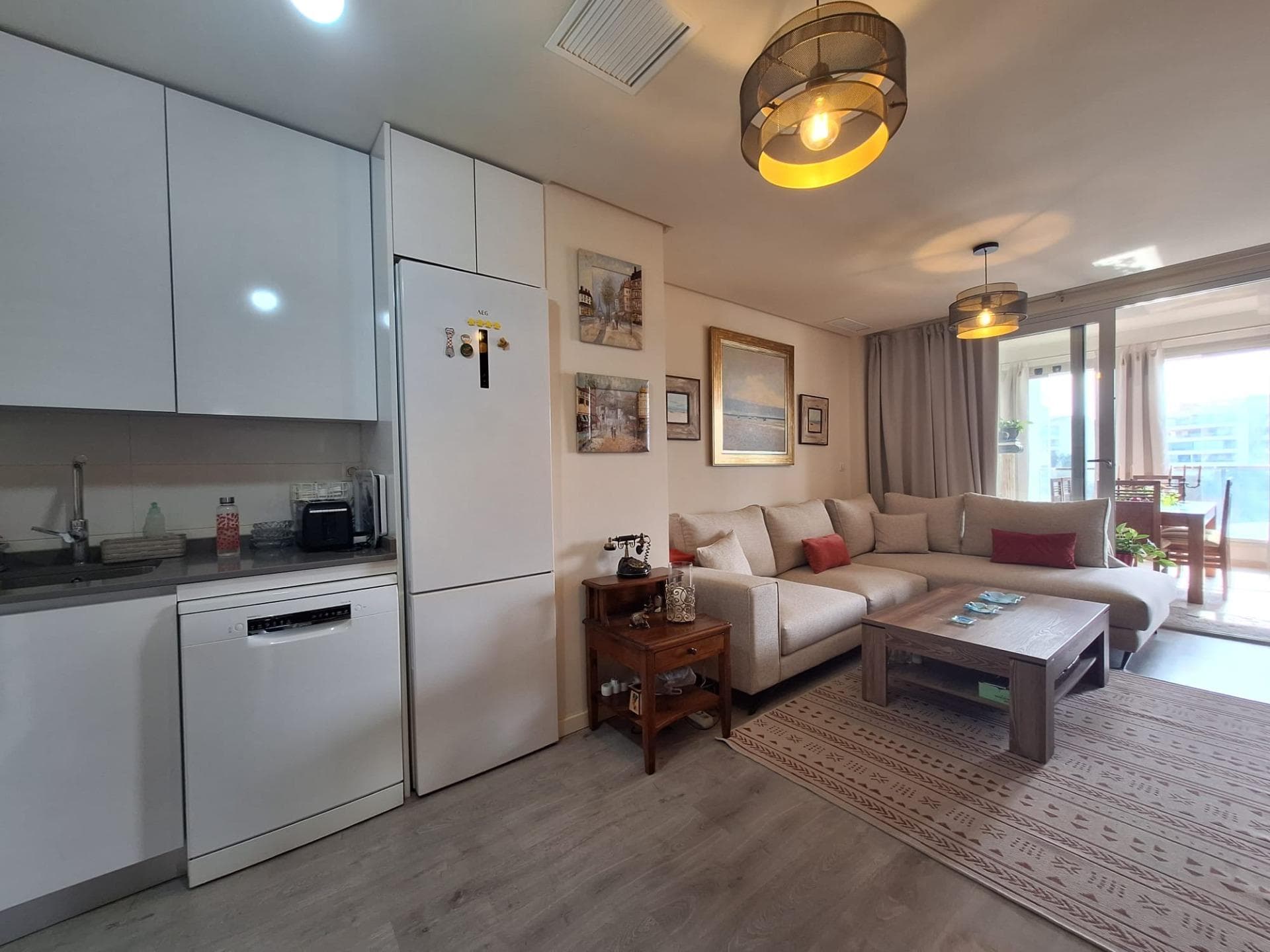 Discover this spectacular apartment located in the privileged area of Orihuela Costa, ideal for enjoying the Mediterranean lifestyle. With a constructed area of 93 m² and a usable area of 82 m², this property is ready to move in. The southeast orientation allows the space to be bathed in natural light throughout the day, creating a warm and welcoming environment. The apartment features two bedrooms (one double), perfect for both families and those seeking additional comfort. It also has two full bathrooms, which is very practical. In the common areas, you can enjoy not only the sun by the heated pool but also have fun playing ping pong thanks to the available tables within the complete urbanization: private parking included ensures your peace of mind and comfort. Strategically located just 1600 meters from the Mediterranean Sea, it is perfect for those beach lovers without giving up modern conveniences.