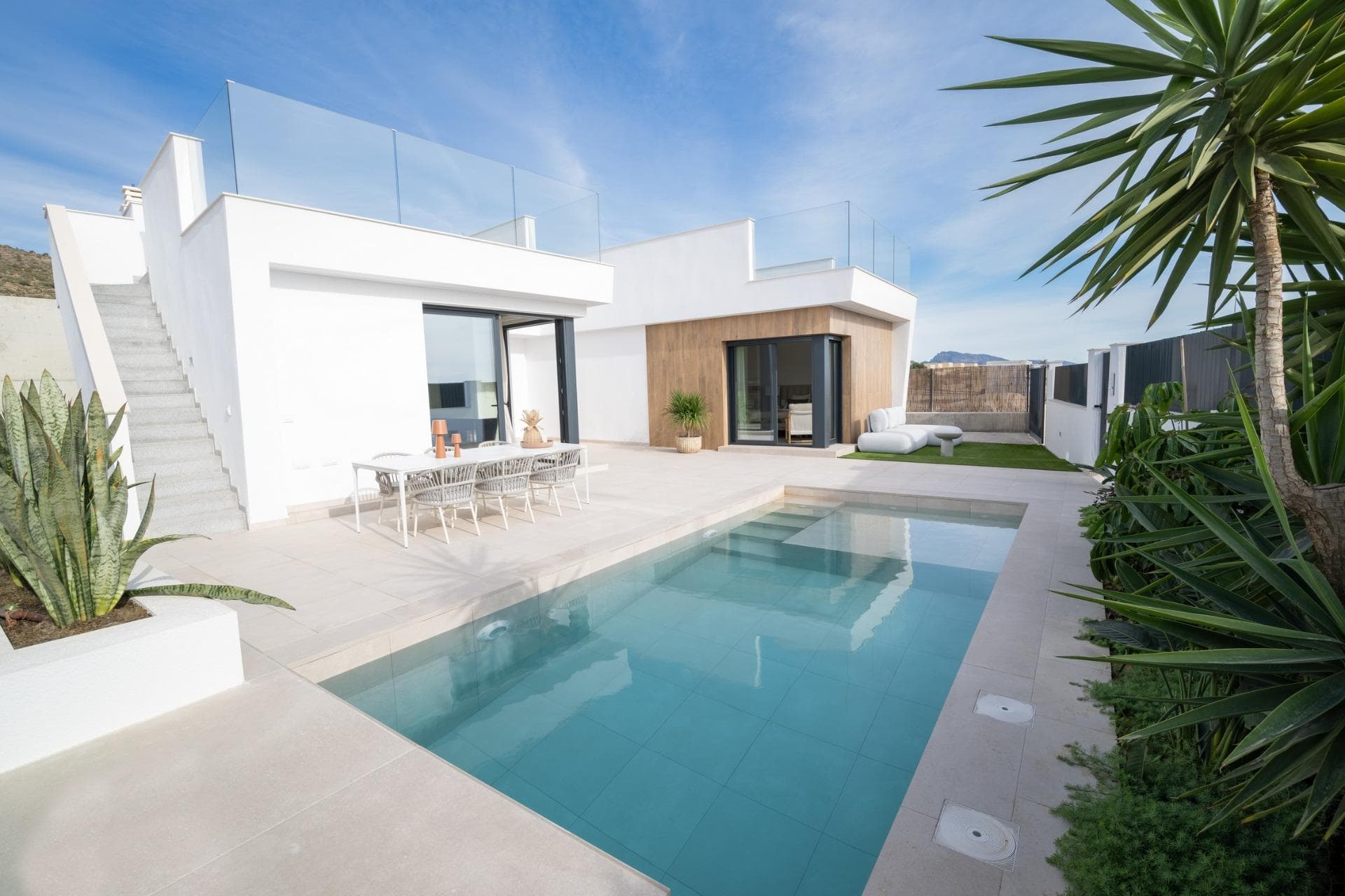 New Build Villas in Altaona Golf Resort Murcia with Private Pool and Mountain ViewsContemporary Villas in Altaona Golf Resort MurciaDiscover an exclusive new development of modern villas located in Altaona Golf Resort, one of the most attractive residential areas in Murcia. Surrounded by natural landscapes and mountains, this secure golf resort offers a peaceful environment while being just a short drive from the city of Murcia and the Mediterranean coast.These new build villas are designed to provide comfort, privacy and a relaxed Mediterranean lifestyle. The development offers a selection of villas on one level with optional solarium or two level layouts, all featuring three bedrooms and two bathrooms, including a master bedroom with en suite bathroom.Spacious Design with Private Gardens and PoolEach villa is built on a private plot starting from 300 m2, offering ample outdoor space to enjoy the sunshine all year round. The properties include a private swimming pool, landscaped garden areas and on plot parking.The interior layout is designed to maximize natural light and create a seamless connection between indoor and outdoor living. Open plan living and dining areas connect directly to the terrace and pool, creating the perfect setting for relaxing or entertaining family and friends.Quality Finishes and Modern FeaturesThese villas are built using high quality materials and modern construction techniques to ensure comfort and energy efficiency. Features include a reinforced security entrance door, fully fitted kitchen with appliances, underfloor heating in bathrooms and interior LED lighting package.Additional specifications include pre installation for ducted air conditioning and hot water production via an energy efficient aerothermal system, providing both sustainability and cost savings.Prime Location Close to Golf, City and CoastAltaona Golf Resort is known for its 18 hole golf course, peaceful surroundings and excellent security, making it ideal for both permanent living and holiday homes. The resort offers a unique combination of nature, sport and proximity to key destinations.Murcia city center is located just 15 km away, offering a wide range of shops, restaurants, cultural attractions and services. The beaches of the Mar Menor and the Mediterranean coast are approximately 20 km away, perfect for enjoying sunny days by the sea.Other key distances include Murcia Corvera Airport 15 km, Cartagena city 35 km and several golf courses within a short drive, making this an ideal location for golf lovers and international buyers.Ideal Investment and Mediterranean Lifestyle OpportunityThese new build villas in Altaona Golf Resort offer an excellent opportunity to enjoy a high quality lifestyle in a natural and secure environment, with easy access to both the city and the coast.Contact us today for more information or to arrange a viewing and discover your new home in Murcia.