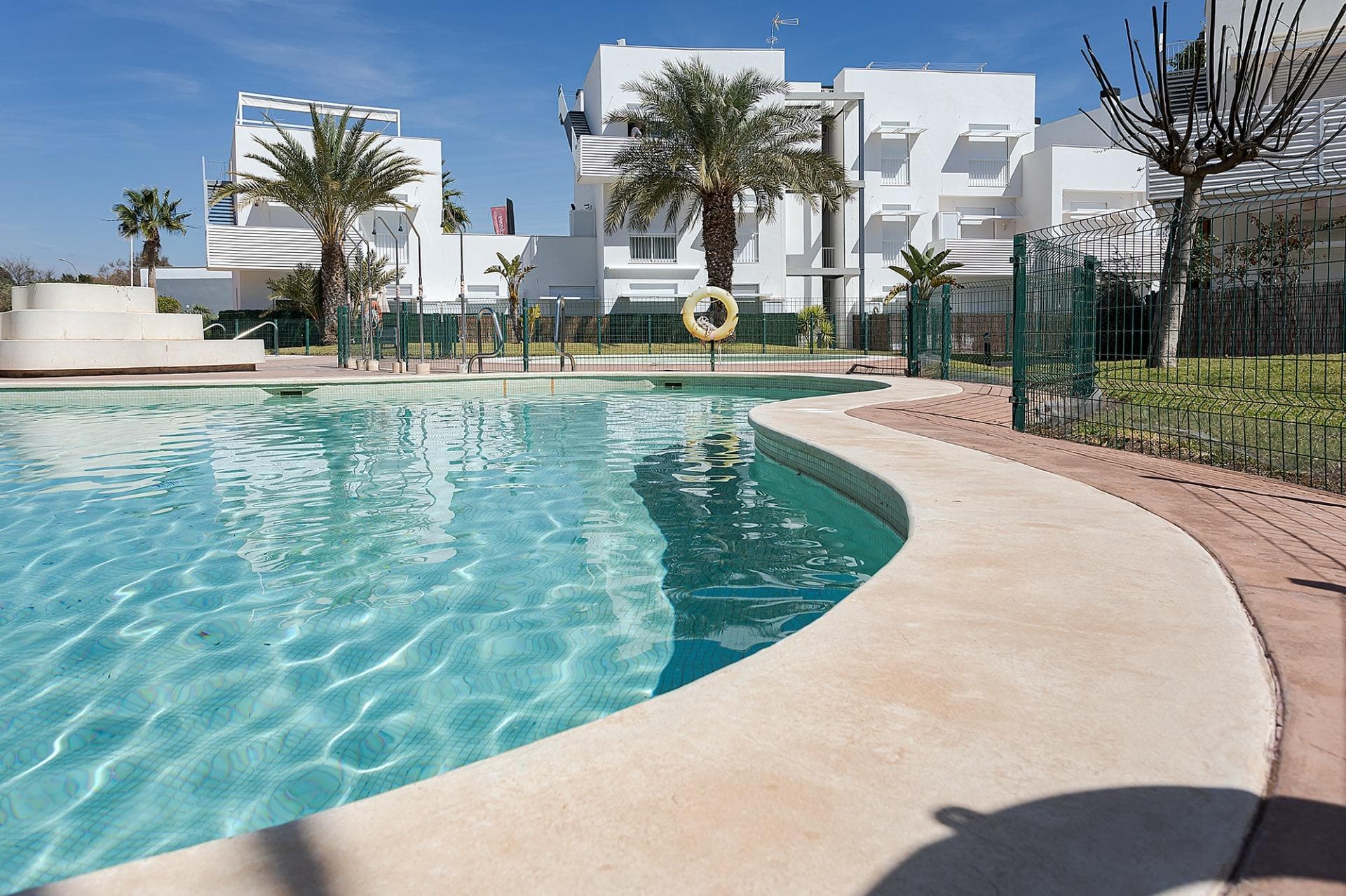 NEW BUILD RESIDENTIAL COMPLEX IN VERA New Build residential of apartments in Vera just 400m from the huge Vera beach named "El Playazo". The typologies are ground floor with two private gardens, one in each orientation, which allows you to enjoy sun or shade whenever you want depending on the time of day or the season of the year. The first floors have terraces and the penthouses have large solariums. All the apartments have extra height ceilings (2.95 m) providing a great feeling of spaciousness. The kitchen comes fully furnished and equipped integrated with the living-dining area with a bar area.  The doors and fitted wardrobes are lacquered in white and the floor is made of laminated wood.  The hot-cold air conditioning and the hot water are generated by a state-of-the-art DAIKIN Aerothermal device, a technology that saves up to 70% of electricity consumption compared to traditional systems.  All bathrooms come with a shower instead of a bathtub, with recessed mirrors and also with a stone countertop and glass partition in the main bathroom.  The blinds in the living room and master bedroom are electric, hermetically sealed and with adjustable slats.  The gardens and solarium are delivered with the floors finished combining artificial grass and a beautiful paving imitating wood.  Each house includes a private outdoor parking space. Each block of the promotion has an independent elevator. Both the buildings and the apartments have a series of bioclimatic architecture characteristics (orientation, insulation, windows and shutters, pergolas) that allow optimal natural regulation of ventilation, temperature and light throughout the different seasons of the year.  The communal areas are made up of pedestrian squares and green areas, with a large swimming pool for adults and another for children in the central square.  The entire urbanization is free of architectural barriers for the disabled. Here tranquillity and relaxation are guaranteed.  Vera is one of the best naturist places in Europe, recognized for the quality and purity of their waters. It offers six kilometres of beaches (Las Marinas-Bolaga, Puerto Rey, El Playazo, Quitapellejos). Vera bordering with the famous tourist destinations such as Mojacar and the Almanzora Caves. Residential complex located about 1,5 hour drive away from Murcia - Corvera airport and about 2 hours away from Alicante airport.