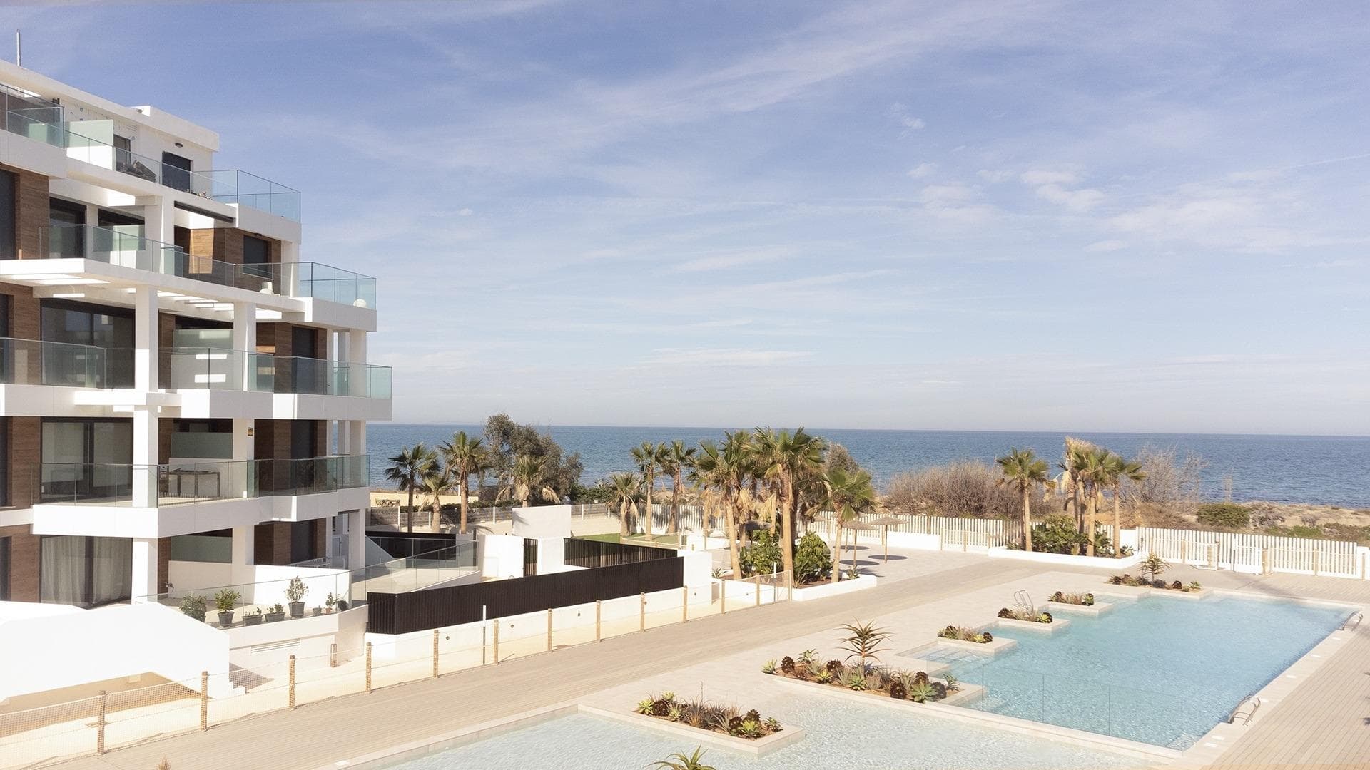 MEDITERRANEAN HOUSING A FEW METERS FROM THE SEA Exclusive complex of Mediterranean construction a few meters from the sea. On the beachfront, in front of L´Estanyo beach (7 km from the town center). Apartments and penthouses with two and three bedrooms, all with sea views. Magnificent common areas with a large garden area and two swimming pools, one for children. In an unbeatable location, in the area known as L´Estanyo that gives its name to its beach, with calm waters, an extensive area of ​​golden sand surrounded by all facilities and services, as well as leisure and restaurant venues.