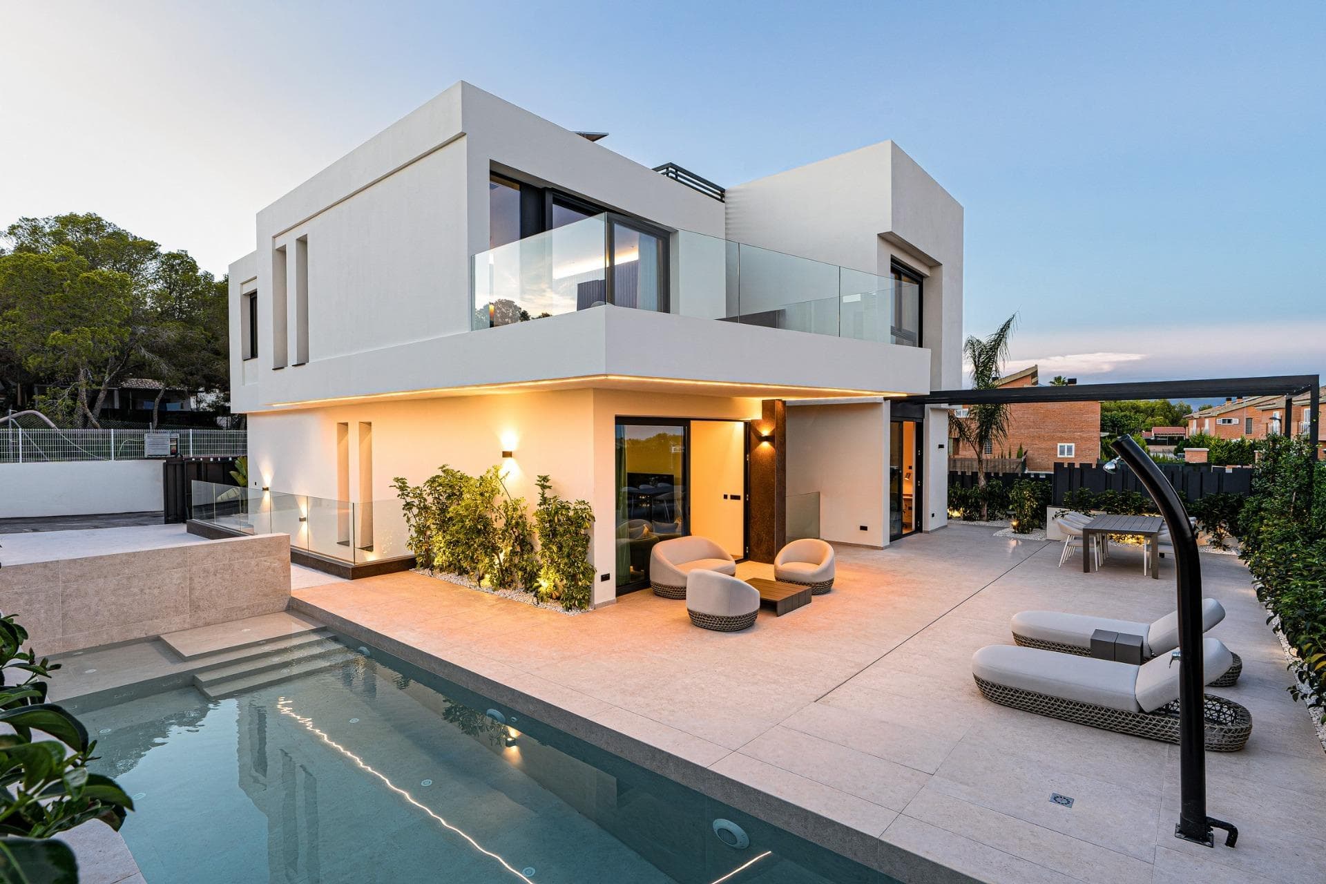 Exclusive New-Build Villas with Private Pools in La Nucía, Near BenidormPremium Gated Residential Community with Unmatched SecurityIntroducing an exclusive collection of just 10 detached villas in La Nucía, adjacent to the prestigious Coblanca urbanization of Benidorm and less than 4 km from the beach. This secure gated development offers the perfect blend of Mediterranean lifestyle, luxury, privacy, and peace of mind, with 24/7 perimeter surveillance and a dedicated night guard.Each villa boasts its own private garden with native plants, a private outdoor pool with a waterfall feature, and a rooftop solarium with panoramic views of the surrounding area and the Mediterranean Sea. The community provides full garden and pool maintenance, plus a helpful service for everyday home repairs, making these homes ideal for stress-free living or as a holiday retreat.Spacious Design and High-End FeaturesThese villas are built over three levels: ground floor, upper floor, and a semi-basement with independent access and an interior courtyard that provides natural light and ventilation. All homes feature 4 or 5 bedrooms and 4 or 5 bathrooms, a large open-plan living and dining room, a fully equipped kitchen with Miele appliances, and a covered terrace with a barbecue area.Key features include:Rooftop installation of 10 solar panelsSmart home automation for lighting and blindsDucted air conditioning system throughout the villaDouble-glazed windows with thermal break and motorized shuttersDesigner bathrooms with furniture, mirrors, and shower screensOptional lift installationSemi-basement with customizable finishesPrime Location on the Costa BlancaLa Nucía is a well-connected and vibrant town located just minutes from Benidorm and Altea. The development offers close access to all essential services including schools, healthcare, supermarkets, and restaurants.Key distances:Benidorm beach: 3.5 kmAlbir beach: 6 kmAlicante Airport: 60 km (approx. 45 minutes by car)Villaitana Golf: 5 kmLa Marina Shopping Center: 6 kmPuerto Deportivo de Altea: 8 kmLive the Mediterranean Life with Total Comfort and SecurityThis is a rare opportunity to own a state-of-the-art villa in one of the most secure and exclusive communities on the Costa Blanca. Contact us today for more information or to arrange a private viewing to the Show House.