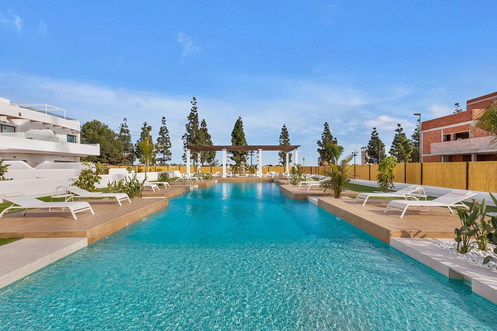 New Build Residential Complex Near Serena Golf and the Mar Menor in Los AlcazaresModern Coastal Living on the Costa CalidaDiscover this attractive new build residential complex located in Los Alcazares, one of the most popular seaside towns on the Costa Calida. Situated just 500 m from the beaches of the Mar Menor and within walking distance of the town center, this development offers an excellent combination of coastal living, golf surroundings and everyday convenience. Los Alcazares is well known for its relaxed atmosphere, long promenades, warm shallow waters and a wide range of restaurants, shops and services open all year round.Contemporary Apartments Designed for ComfortThe development consists of 29 modern homes with 2 or 3 bedrooms, designed with clean architectural lines and high quality finishes. Buyers can choose between ground floor apartments with private garden and terrace, middle floor homes with spacious terraces, or penthouses with private terrace and rooftop solarium offering open views. Many of the properties enjoy views towards Serena Golf and the Mar Menor, creating a calm and pleasant living environment.All homes are designed to maximize natural light and functionality, making them ideal as a permanent residence, holiday home or investment property.High Quality Features and Communal AreasEach property includes a private parking space and a storage room. The specifications are designed to provide comfort and energy efficiency, including double glazed windows with thermal break, pre installation of ducted air conditioning, aerothermal system for domestic hot water, electric shutters in bedrooms and a complete interior and exterior lighting package. Bathrooms are delivered fully equipped with furniture, mirror and shower screen.Residents can enjoy attractive communal areas with landscaped gardens and a communal swimming pool, perfect for relaxing and enjoying the Mediterranean climate. Selected blocks are equipped with lifts for added convenience.Prime Location Between Golf and SeaThis residential complex enjoys a privileged location next to Serena Golf, one of the most renowned golf courses in the area, and just a short walk from the calm waters of the Mar Menor. The area is ideal for swimming, sailing, paddleboarding and other water sports throughout the year.Key distances include Mar Menor beaches at 0.5 km, Serena Golf directly next to the development, Los Alcazares town center at 2 km, Cartagena at 22 km and Murcia city at 40 km. Murcia Corvera Airport is approximately 30 km away and Alicante Airport is around 90 km.An Ideal Home or Investment OpportunityWith its excellent location, modern design and proximity to both golf and the sea, this new residential complex in Los Alcazares offers an outstanding lifestyle opportunity on the Costa Calida. Contact us today to receive more information or to arrange a private viewing and secure your new home by the Mar Menor.