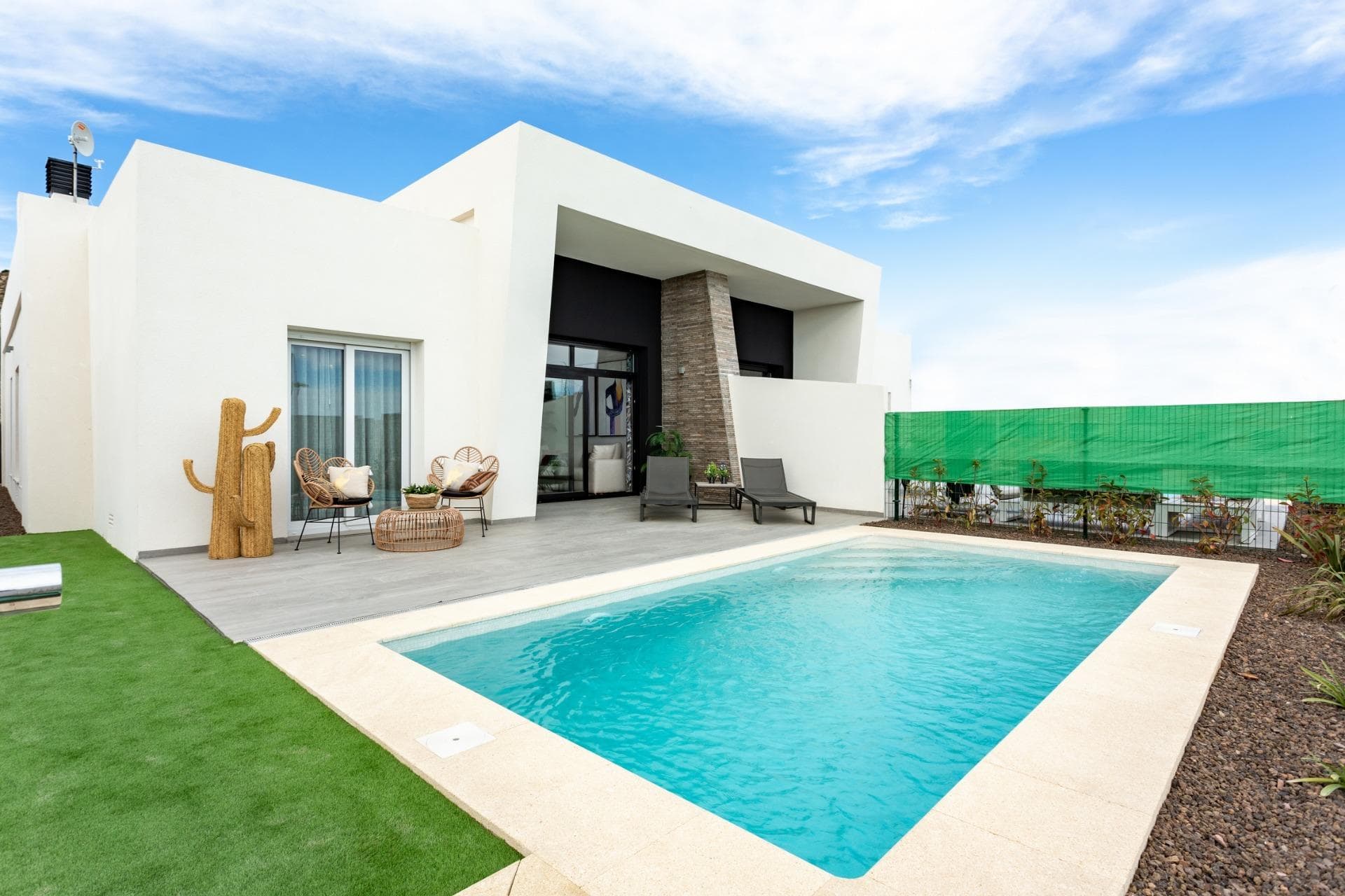 New Build Semi Detached Villas with Private Pool at La Finca Golf Resort AlgorfaModern Villas in a Prestigious Golf Resort on the Costa BlancaDiscover these elegant new build semi detached villas located in the exclusive La Finca Golf Resort in Algorfa, one of the most desirable residential areas on the Costa Blanca South. Surrounded by nature, golf courses and peaceful landscapes, this development offers the perfect balance between tranquility and proximity to essential services, beaches and leisure facilities.La Finca Golf Resort is well known for its championship golf course, luxury hotel, restaurants and wellness facilities. The nearby town of Algorfa maintains its traditional Spanish charm while offering convenient access to larger coastal destinations such as Torrevieja and the beautiful beaches of the southern Costa Blanca.Stylish Single Level Villas with Spacious LayoutsEach villa offers approximately 105 m2 of built area on generous plots from 450 m2. The homes are designed on a single level to maximize comfort and accessibility while providing bright and open living spaces.The property features three spacious bedrooms with built in wardrobes and two modern bathrooms, including a master bedroom with en suite bathroom. Bathrooms are equipped with mirrors and walk in showers with glass screens for a clean and contemporary design.The open plan kitchen integrates seamlessly with the living and dining area and includes a practical breakfast bar, creating a bright and functional space ideal for both everyday living and entertaining. A separate laundry room adds extra convenience to the home.An external staircase leads to the large private rooftop solarium, providing additional outdoor space to relax and enjoy the Mediterranean climate.Private Pool and Outdoor Mediterranean LifestyleLarge sliding glass doors connect the interior living area with the outdoor terrace and landscaped garden. Each villa includes a private swimming pool, creating the perfect environment for relaxing afternoons, outdoor dining and enjoying the warm Costa Blanca weather.The homes also include fully installed ducted air conditioning to ensure year round comfort.Prime Location Near Beaches Golf and AmenitiesThese villas are ideally located within walking distance of the golf course and close to many key destinations in the region.La Finca Golf Resort golf course walking distanceGuardamar del Segura beaches 20 kmZenia Boulevard shopping center 15 kmTorrevieja 20 kmAlicante Elche Airport 40 kmRegion de Murcia International Airport 55 kmThe area is also surrounded by additional golf courses, nature parks and coastal promenades, offering an excellent lifestyle for golf enthusiasts and beach lovers alike.Secure Your Villa at La Finca Golf ResortThese new build semi detached villas combine modern design, private outdoor living and a prime golf resort location. Contact us today to receive more information or schedule a visit and discover your new home at La Finca Golf Resort in Algorfa.