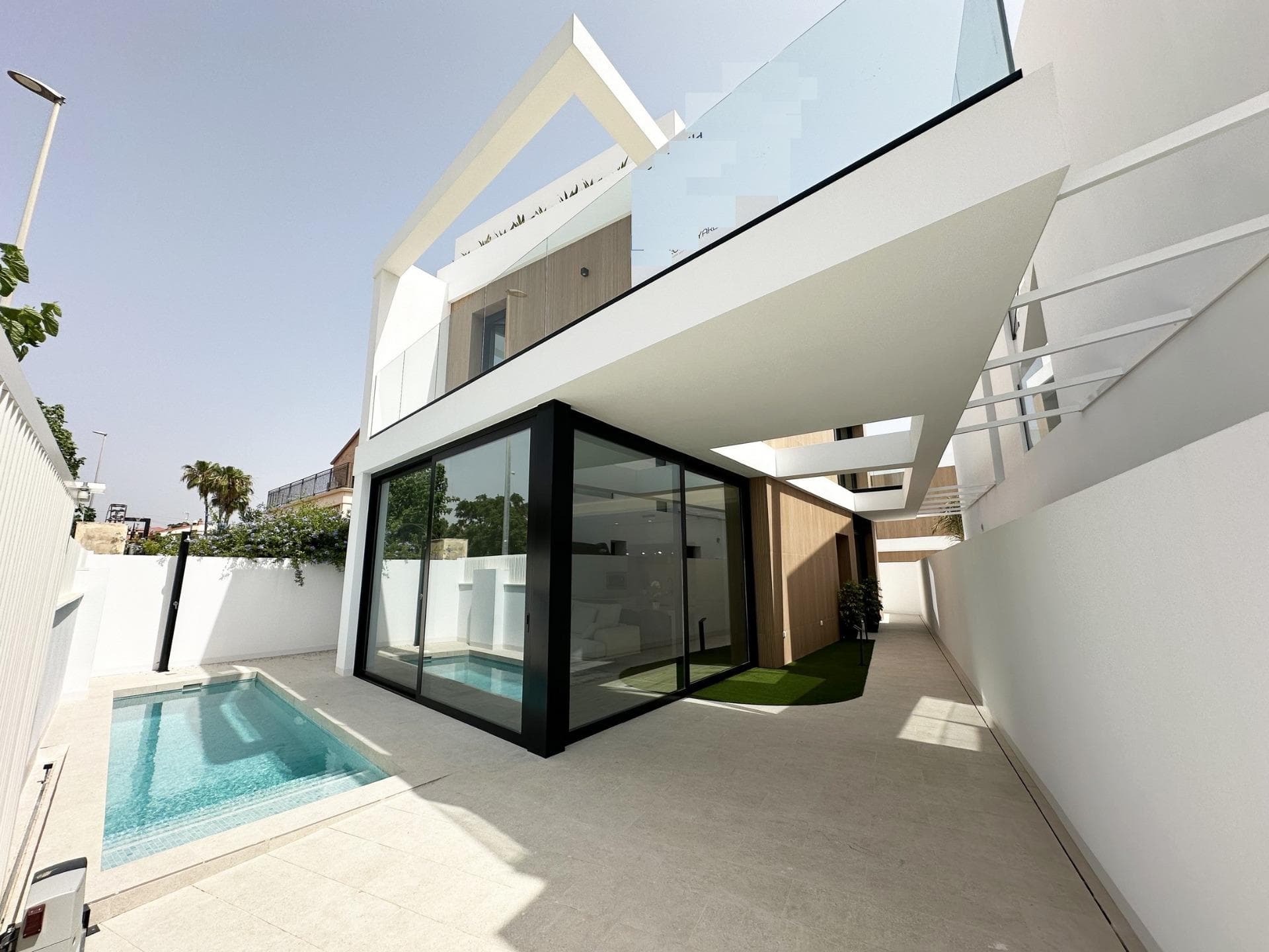 Exclusive New Build Villas 300 m from the Beach in Torre de la HoradadaLuxury Coastal Living in a Prime LocationDiscover this exclusive new build villa project in Torre de la Horadada, one of the most sought after coastal towns in the south of Alicante. Located just 300 m from the Mediterranean Sea and within walking distance of shops, restaurants and daily services, these villas offer an exceptional opportunity to enjoy the Costa Blanca lifestyle. Torre de la Horadada is known for its relaxed atmosphere, beautiful promenade and fine sandy beaches, making it ideal for both permanent living and holiday use.Last Key Ready Villa Fully EquippedThis boutique development consists of only four independent villas, with the last unit available key ready and fully furnished. The villa is delivered complete with furniture, appliances and ducted air conditioning, allowing you to move in immediately and start enjoying your new home by the sea. Set on a private plot of approximately 207 m2, the villa offers around 130 m2 of built space distributed over ground floor, first floor and a private rooftop solarium.Modern Design with Private Pool and SolariumThe villa features a contemporary design with open and bright spaces. Inside, you will find three spacious bedrooms and three bathrooms, a living dining area with an open plan kitchen, and direct access to the garden and private swimming pool. The rooftop solarium provides an ideal space to relax, sunbathe or enjoy open views, creating a perfect outdoor living area all year round.High Quality Specifications and ComfortThe property is built to high standards and includes a reinforced entrance door, motorised shutters in the bedrooms, a private swimming pool, and a basic home automation system for electronic controls. Ducted air conditioning is fully installed, ensuring comfort in all seasons. A private parking space within the plot adds convenience and security.Torre de la Horadada and SurroundingsTorre de la Horadada offers a charming coastal environment with a long seafront promenade, marinas and a wide range of restaurants, bars and local shops. The nearby beaches of Torre de la Horadada and Mil Palmeras are among the best in the area, ideal for swimming, water sports, snorkelling and diving. The area is well connected and surrounded by golf courses, shopping centres and leisure options.Distances to Main Points of InterestBeach: 0.3 kmPlaza Nueva shopping area: 0.2 kmLo Romero Golf: 7 kmMarina of Torre de la Horadada: 1.5 kmMurcia Corvera Airport: 45 kmAlicante Airport: 50 kmYour New Home by the Mediterranean AwaitsThis key ready villa in Torre de la Horadada is a unique opportunity to own a modern home just steps from the beach. Contact us today to arrange a viewing and secure this exceptional new build villa on the Costa Blanca.