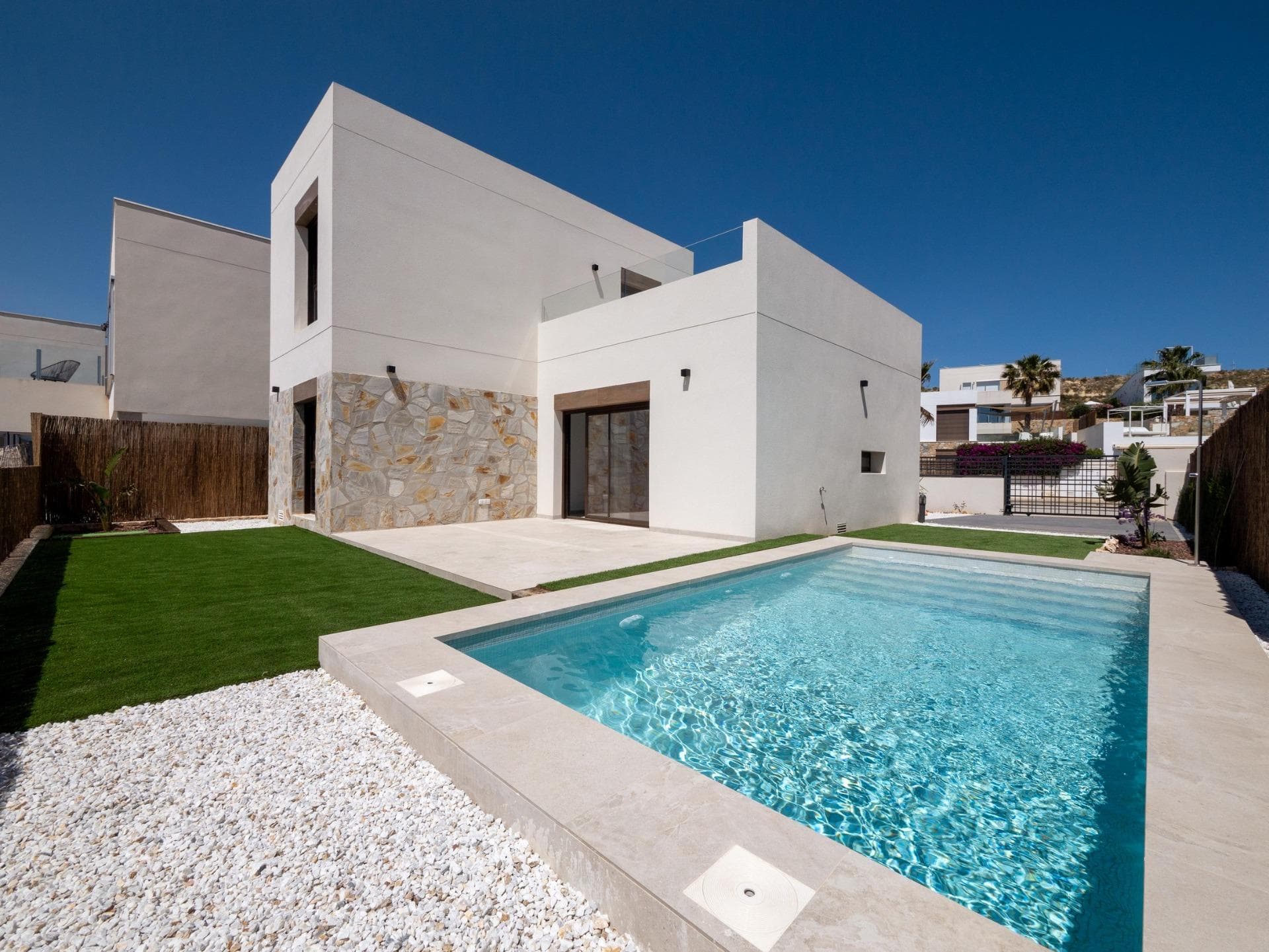 Exclusive New-Build Villas in Algorfa Golf Course AreaDiscover these stunning new-build villas in Algorfa, nestled in the serene surroundings of one of Spain’s most prestigious golf resorts, La Finca Golf &amp; Spa Resort. Located in the southern part of Alicante Province, this exclusive development combines luxurious living with the benefits of resort-style amenities, creating the ideal home for golf enthusiasts and those seeking a relaxed Mediterranean lifestyle.Elegant 3-Bedroom Villas with Private Pool and Modern DesignEach villa is thoughtfully designed over two spacious floors, featuring 3 bedrooms and 2 bathrooms. The open-plan kitchen flows seamlessly into the living area, where large windows and sliding glass doors provide abundant natural light and direct access to the terrace and private pool. A convenient private parking space is included on the plot, enhancing the ease and exclusivity of these homes.Premium Features and Smart Home TechnologyThese villas come with a range of high-end features to provide maximum comfort and security. Enjoy the convenience of private indoor parking, electric shutters, ducted air-conditioning, and a sophisticated home automation system. Additionally, a fully fitted alarm system ensures peace of mind. The south/southwest orientation allows for optimal natural lighting year-round, reducing energy consumption by providing warmth and brightness from sunrise to sunset.Bright, Open-Concept Living Spaces with Traditional TouchesDesigned with an open concept, these homes use large windows and sliding doors to promote cross-ventilation, keeping the interiors fresh and filled with natural light. The architectural design combines modern aesthetics with traditional elements, like stone accents on the façade and wooden details, creating a warm, inviting atmosphere. With an EPC A rating, these villas offer energy efficiency and sustainability, making them an eco-friendly choice for homeowners.Prime Location with Access to Beaches and Key AttractionsSet in the well-established town of Algorfa, these villas are just a short drive from the pristine beaches of Guardamar and Torrevieja, where you can enjoy over 300 days of sunshine each year. Nearby, you’ll find shopping centers, fine dining restaurants, and vibrant entertainment venues. Excellent infrastructure and proximity to major roads, including the AP-7 motorway, ensure easy connections to popular destinations like Orihuela, Elche, Murcia, and Alicante. Alicante Airport is only 40 km away, while Murcia Airport is 55 km, making travel convenient.Your Mediterranean Dream Home Awaits – Contact Us TodayDon’t miss this opportunity to own a luxurious villa in Algorfa’s most prestigious golf resort area. Experience the perfect blend of modern comfort, traditional charm, and Mediterranean lifestyle. Contact us now to arrange a viewing and discover your dream home.