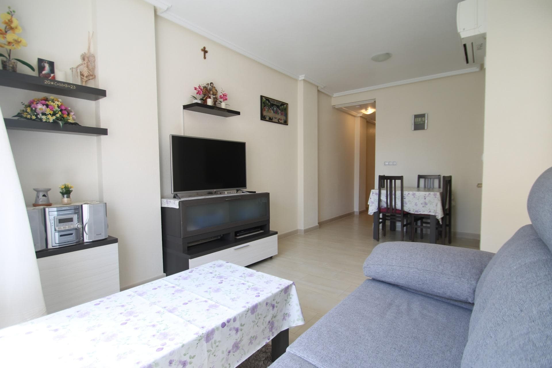 Sometimes, a property does not need any big extras to win you over. It is enough for it to feel well kept, comfortable, and to give you that sense that life here could be easy from day one. This apartment has exactly that: a very practical layout, lovely morning light, and two double bedrooms with two full bathrooms, which is not always so easy to find. One of the bathrooms is also en suite, making the property even more comfortable for everyday living. The building is well maintained and feels peaceful, with the added benefit of 24-hour video surveillance. And around it, everything is convenient: everyday services, all you need close by, and the sea at a reasonable distance so you can enjoy it without giving up a quieter lifestyle. A home that works easily, whether as a permanent residence or as a second home. Taxes and purchase costs are not included.