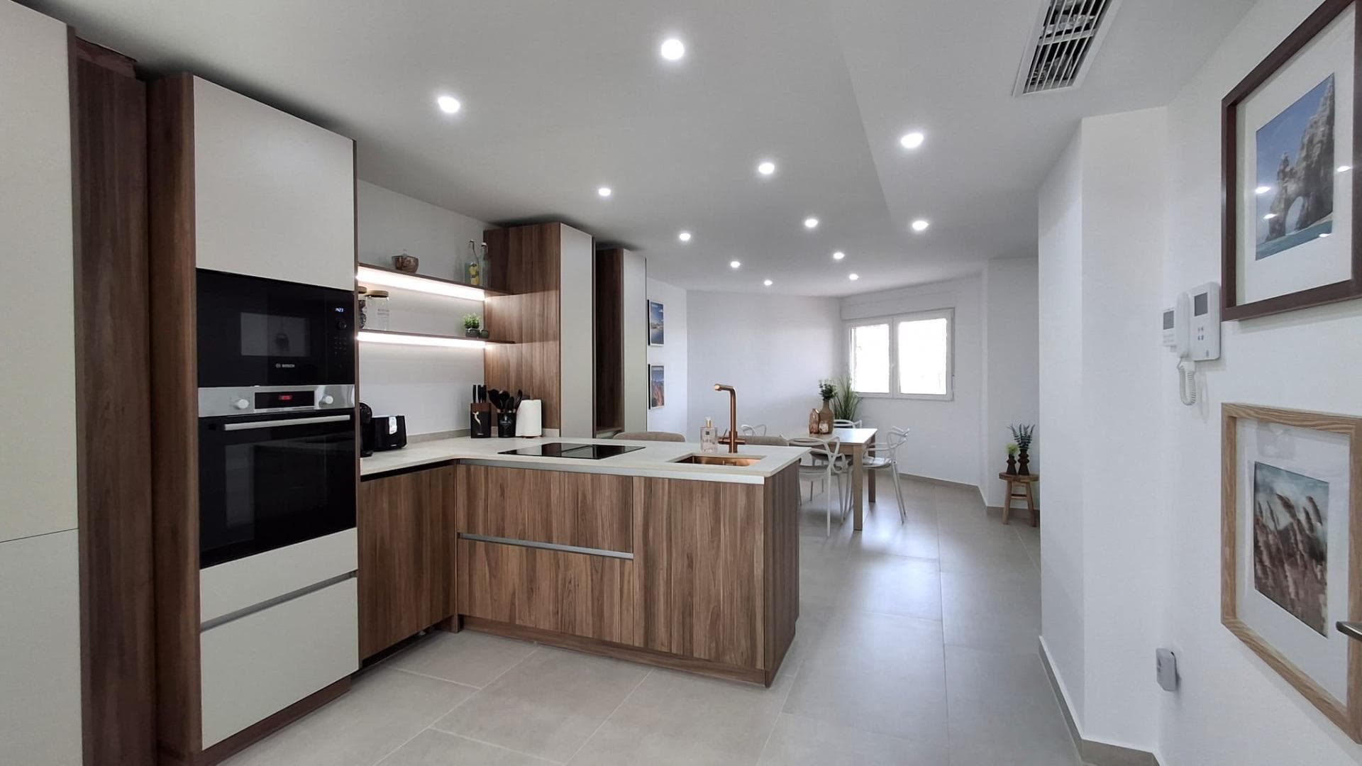 Amazing 2 bedrooms, 2 bathrooms apartment fully renovated and located just 50 meters from Acequión Beach in Torrevieja. The property has been refurbished using high-quality materials and features a contemporary design with modern tiles, stylish decoration, and an elegant atmosphere that combines comfort and functionality. The living area is connected to an innovative open-plan kitchen with a central island, fully equipped and perfect for everyday living. The apartment is sold fully furnished and equipped, ready to move in. It includes air conditioning through conducts, appliances, TV, and a video intercom system, ensuring both comfort and security. One of the standout features of this property is its pleasant views of a green park area, offering a relaxing and open environment. Its prime location allows you to enjoy the sandy beach just a few steps away, making it ideal as a permanent residence, holiday home, or investment. A perfect opportunity for those looking for quality, location, and views in one of the most sought-after areas of Torrevieja.