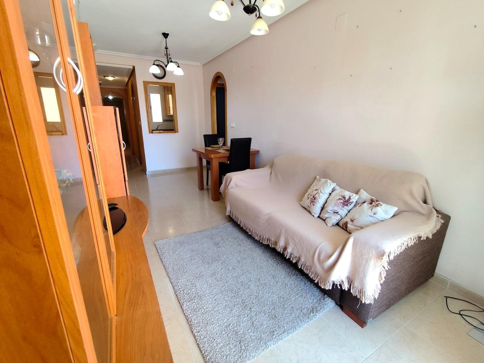 This property on the emblematic Bazán Street is not just an apartment; it is the opportunity to experience the essence of the Mediterranean with all urban conveniences within your reach. The property is distributed into a spacious living-dining room flooded with natural light. Its undeniable jewel is the large east-facing terrace, the perfect corner to enjoy sunny breakfasts or a peaceful reading session with the morning breeze. It features two double bedrooms, spacious and versatile, and a full bathroom. The fully independent and equipped kitchen stands out for its brightness, allowing you to cook in an open and comfortable environment. Living here means having everything at hand. Just 800 metres from the beach, you can enjoy the sea without needing a car. In addition, you will be only a few steps from the emblematic Constitution Church, surrounded by services, restaurants, and the vibrant life of the town centre. Don’t miss this opportunity! Homes with sunny terraces in the city centre are the first to sell. Contact us today to schedule your visit and come feel the light of this home.