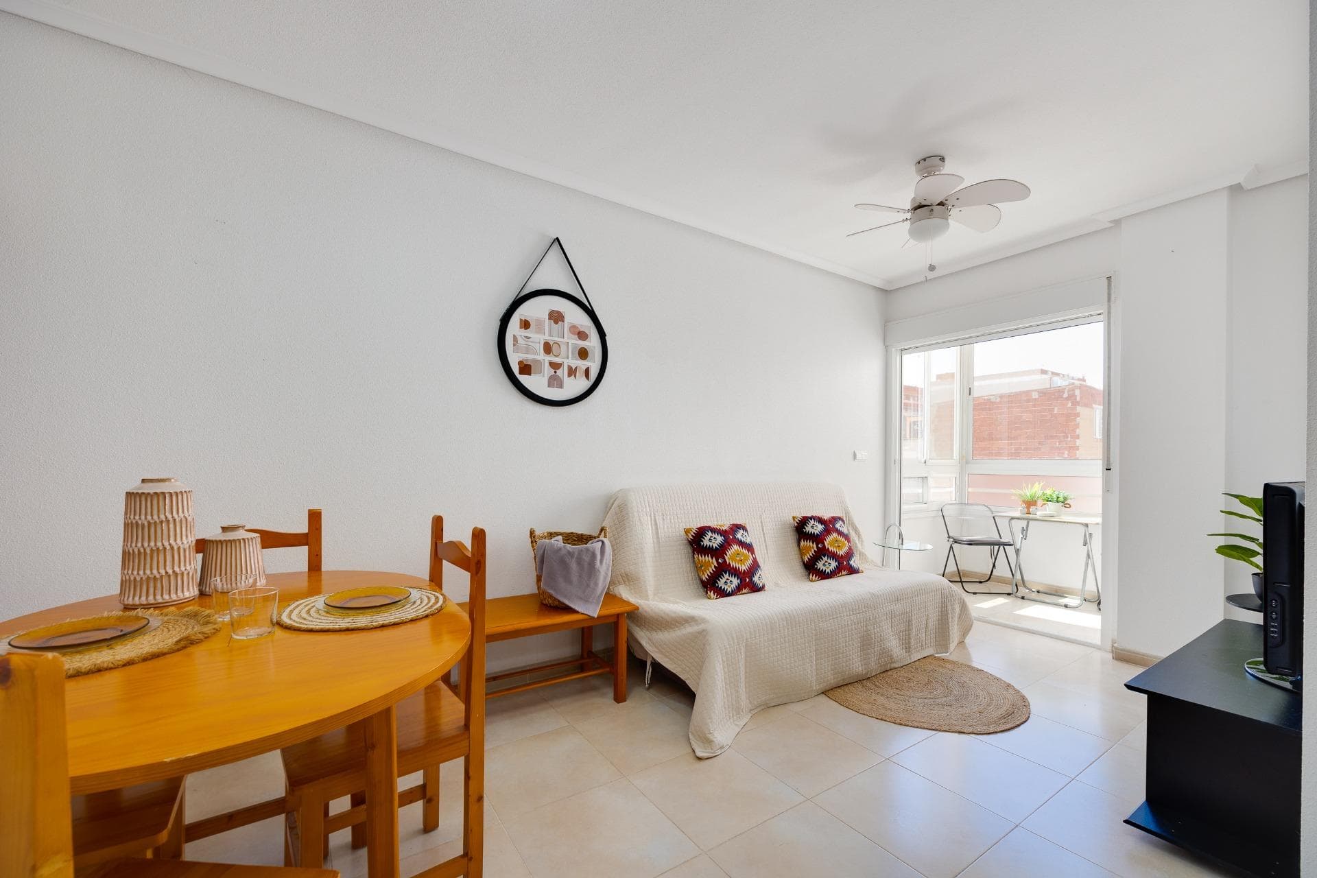 We present this excellent property located in the centre of Torrevieja, a strategic location that combines the convenience of having all services and the city's most emblematic areas within walking distance, together with close proximity to the coast. This property represents an ideal option both as a primary or secondary residence and for investors seeking high rental returns. The apartment is situated on the third floor (penthouse) of a building with a lift and fully adapted access for people with reduced mobility. The property stands out for its functional layout, which optimises every square metre while ensuring brightness and comfort throughout. It features a spacious living-dining room integrated with a fully equipped open-plan kitchen, maximising space and enhancing the flow of natural light. Directly connected to the living room, this area enjoys unobstructed views and excellent sun exposure, allowing it to be enjoyed throughout the year. The property also offers a double bedroom with a large built-in wardrobe and a separate fully fitted bathroom. The main added value of this penthouse is its huge private solarium. An independent and generously sized outdoor space, ideal for creating an outdoor dining area, barbecue zone or relaxation space, allowing you to fully enjoy the Mediterranean climate in complete privacy. Located just 700 metres from the beach and surrounded by shops, restaurants, healthcare facilities and public transport, making daily life possible without the need for a car. For further information or to arrange a viewing, please do not hesitate to contact us.