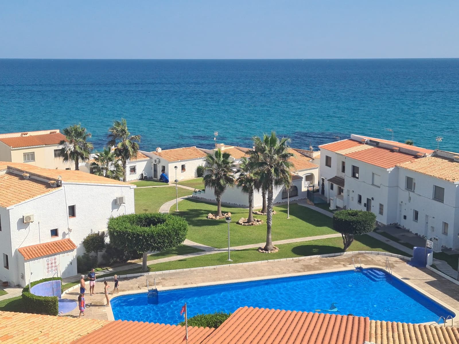 Live the ultimate Mediterranean dream in this spectacular seafront penthouse in Playa Flamenca, just 100 meters from the pristine white sands of the beach. Fully renovated and flooded with natural light, this home offers breathtaking panoramic sea views from every room—even the shower! Imagine waking up, cooking, dining, or relaxing while soaking in the sparkling Mediterranean waters.The apartment features approximately 62 m² of beautifully designed living space, including a spacious bedroom with a built-in wardrobe and a modern bathroom with a walk-in shower—all offering uninterrupted sea views. The open-plan living and dining area flows seamlessly into a sleek, fully equipped kitchen, creating a bright and welcoming environment. Originally a two-bedroom layout, the apartment can easily be converted back, offering flexibility and excellent investment potential.East-south facing, the home enjoys glorious morning sunlight, creating a warm and inviting atmosphere year-round. Integrated air conditioning ensures comfort, while lift access adds convenience in this elevated residential complex. Step onto the sun-soaked terrace for al fresco dining or simply unwind with the Mediterranean as your backdrop.Residents benefit from extremely low monthly community fees of just €48 and an annual council tax of €180, making this an affordable seaside investment with premium amenities.Perfectly located, you are just minutes from vibrant restaurants, cafés, beach bars, supermarkets, and the lively Saturday Street market. Zenia Boulevard, the largest shopping destination in Alicante province with over 150 stores and leisure options, is nearby. Golf enthusiasts will appreciate being only a 10-minute drive from four world-class courses: Villamartín, Las Ramblas, Campoamor, and Las Colinas.With sea views from every room, a prime beachfront location, and incredibly low running costs, this penthouse is perfect as a holiday retreat or permanent residence. Alicante and Murcia airports are just 45 minutes away, making it easily accessible for international buyers. Opportunities like this are rare—don’t miss your chance to own a slice of Playa Flamenca paradise!
