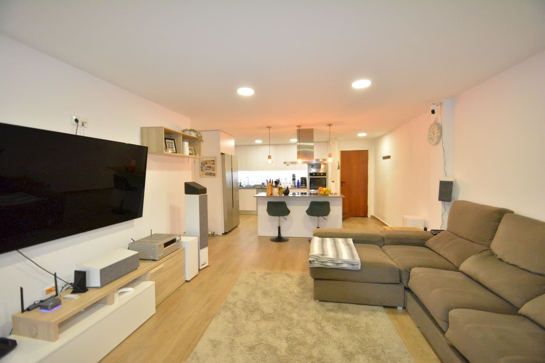 This fully renovated apartment is located in Guardamar del Segura, just 200 meters from the central beach, in a quiet street with all services within walking distance. Guardamar is a well-known coastal town offering long sandy beaches, parks, restaurants, shops, and a relaxed Mediterranean lifestyle, with easy access to Alicante city and the airport by car.The apartment is on the first floor of a building without a lift and offers 93 m² of constructed area and 81 m² of usable space. It is north facing and has three bedrooms and two bathrooms, both with windows that provide natural ventilation. Two of the bedrooms are spacious and face the street and a nearby park, while the smaller bedroom overlooks the internal patio of the building. Built-in wardrobes are included in two bedrooms.The open-plan kitchen is fully equipped and connects well with the living area, creating a comfortable and practical space. The apartment features smooth walls, new flooring, new doors, and new windows in all rooms. Air conditioning with split units is installed in all rooms except the smaller bedroom. There is also a balcony with open views, ideal for enjoying the surroundings.The property is sold with a fully equipped kitchen, but unfurnished. A private parking place is included, adding extra convenience.This apartment is an excellent option for permanent living or as a holiday home, thanks to its quality renovation, excellent location, and proximity to the beach. Taxes and administrative costs are not included in the price. Please contact us to arrange a viewing.