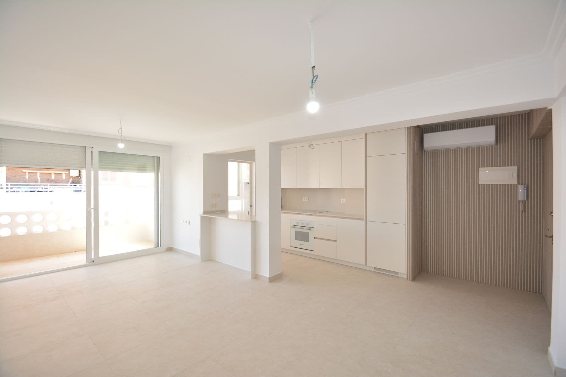 This beautifully renovated apartment in La Mata, Torrevieja, is ready to move in and offers an exceptional opportunity near the beach. Located on the top floor of a building from 1982, the apartment spans 85 m² of living space, including a 4 m² terrace with pleasant views of the surrounding area.The property now features an open modern kitchen fully equipped with appliances, seamlessly integrated into the living space. The apartment has been completely renovated with new plumbing, wiring, floors, windows, and smooth white walls. There are built-in wardrobes in all bedrooms, a fully renovated bathroom with all new sanitary fixtures, and air conditioning installed for year-round comfort.Sold as seen in the photos, the apartment is unfurnished, allowing you to personalize it to your taste. Natural light fills every room thanks to the exterior-facing layout.The building includes an elevator for convenience, and there is open-air parking available on a first-come, first-served basis. Best of all, the property is just 150 meters from the sandy shores of La Mata Beach, perfect for enjoying the Mediterranean lifestyle.Taxes and additional purchase costs are not included. Contact us today to arrange a viewing and experience this modern coastal retreat.