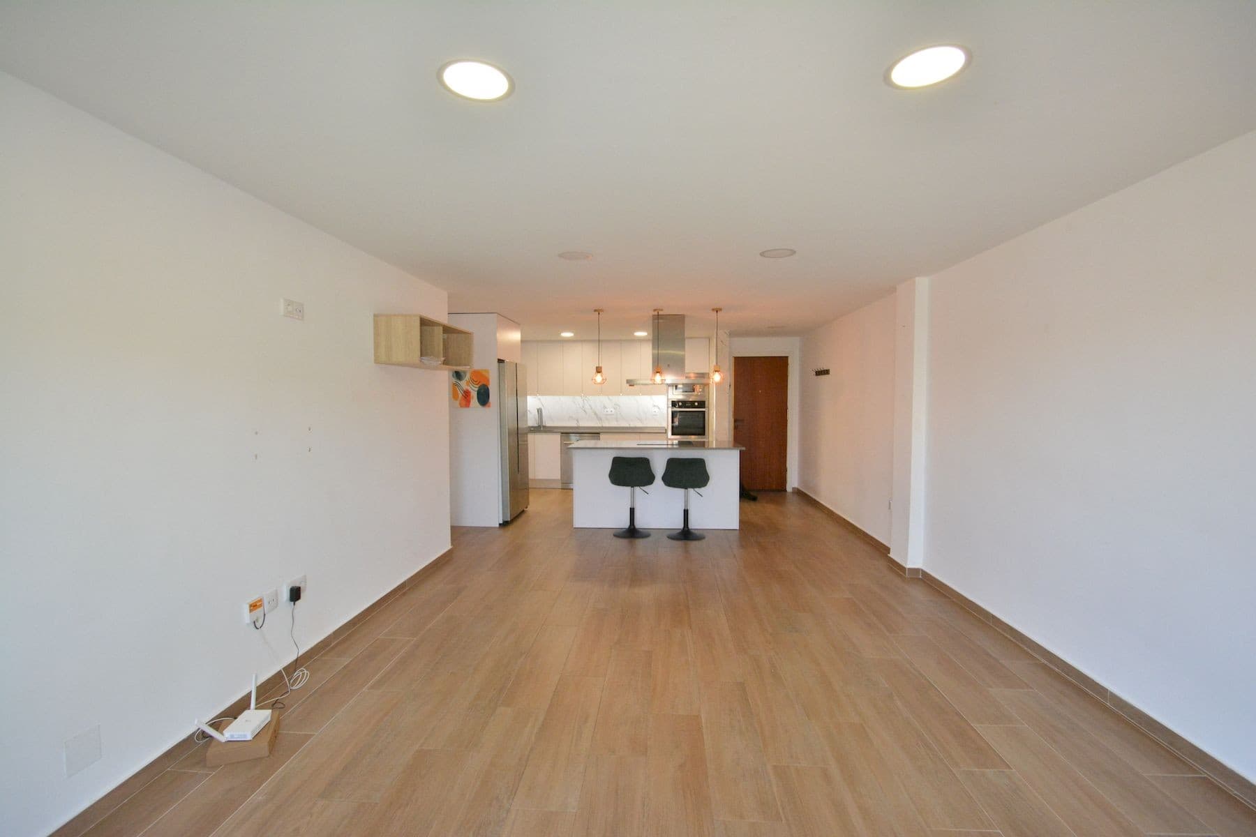 This fully renovated apartment is located in Guardamar del Segura, just 200 meters from the central beach, in a quiet street with all services within walking distance. Guardamar is a well-known coastal town offering long sandy beaches, parks, restaurants, shops, and a relaxed Mediterranean lifestyle, with easy access to Alicante city and the airport by car.The apartment is on the first floor of a building without a lift and offers 93 m² of constructed area and 81 m² of usable space. It is north facing and has three bedrooms and two bathrooms, both with windows that provide natural ventilation. Two of the bedrooms are spacious and face the street and a nearby park, while the smaller bedroom overlooks the internal patio of the building. Built-in wardrobes are included in two bedrooms.The open-plan kitchen is fully equipped and connects well with the living area, creating a comfortable and practical space. The apartment features smooth walls, new flooring, new doors, and new windows in all rooms. Air conditioning with split units is installed in all rooms except the smaller bedroom. There is also a balcony with open views, ideal for enjoying the surroundings.The property is sold with a fully equipped kitchen, but unfurnished. A private parking place is included, adding extra convenience.This apartment is an excellent option for permanent living or as a holiday home, thanks to its quality renovation, excellent location, and proximity to the beach. Taxes and administrative costs are not included in the price. Please contact us to arrange a viewing.