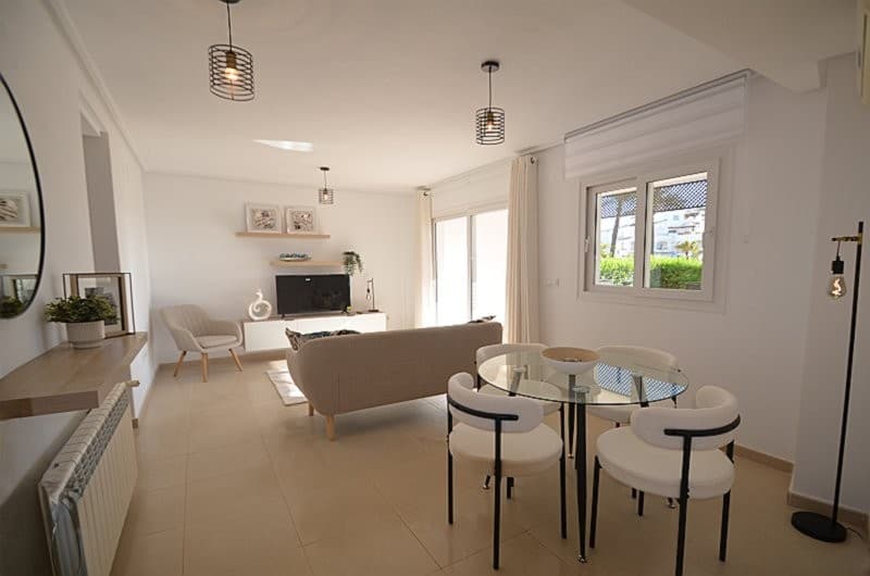 GROUND FLOOR APARTMENTThis apartment has just been newly furnished in a contemporary style and benefits from ALL NEW FURNITURE, FIXTURES AND FITTINGS (save for oven, hob and extractor).This bright and airy ground floor apartment is located on Phase 5 of the Resort.It enjoys views over the communal gardens and is ideally situated just a stone´s throw away from one of the 19 swimming pools and one of the largest of the five lakes beyond.The apartment consists of a good size lounge / diner with large sliding patio doors opening onto a covered terrace which could easily be enclosed with glass curtains providing a space for year round enjoyment. There is also a private garden.The galley style kitchen comprises a range of base units with worktop, oven, hob and extractor and wall units above and a combi-boiler.There are two good sized bedrooms, each with built in wardrobes offering ample hanging and storage space and modern remote controlled ceiling fans.The bathroom has WC, bidet, shower cubicle, vanity unit with wash hand basin and mirror above. The current shower cubicle could be easily removed and replaced with a full width walk-in shower.This style apartment lends itself perfectly to a modification into a trendy American style open plan kitchen, lounge-diner, an example of which can be seen on our website under Remodelled Apartment (remodelling and interior design by QPM).Please CONTACT US to arrange a PERSONAL or VIRTUAL VIEWING before making your final decision to buy and immerse yourself into the LIFESTYLE and CULTURE of this beautiful part of SPAIN.The typical Spanish village of Sucina with its bars, restaurants and church square is just a few minutes away by car.Murcia International airport is located approximately 20 minutes away by car and Alicante airport approximately 1 hour 15 minutes by car.The historic cities of Murcia and Cartagena are both located approximately 40 minutes away by car.The Costa Calida beaches running along the Mediterranean coastline are only a 20 minute drive away by car.Visit the GALLERY on our website to view photographs of places to visit in the local area and beyond.
