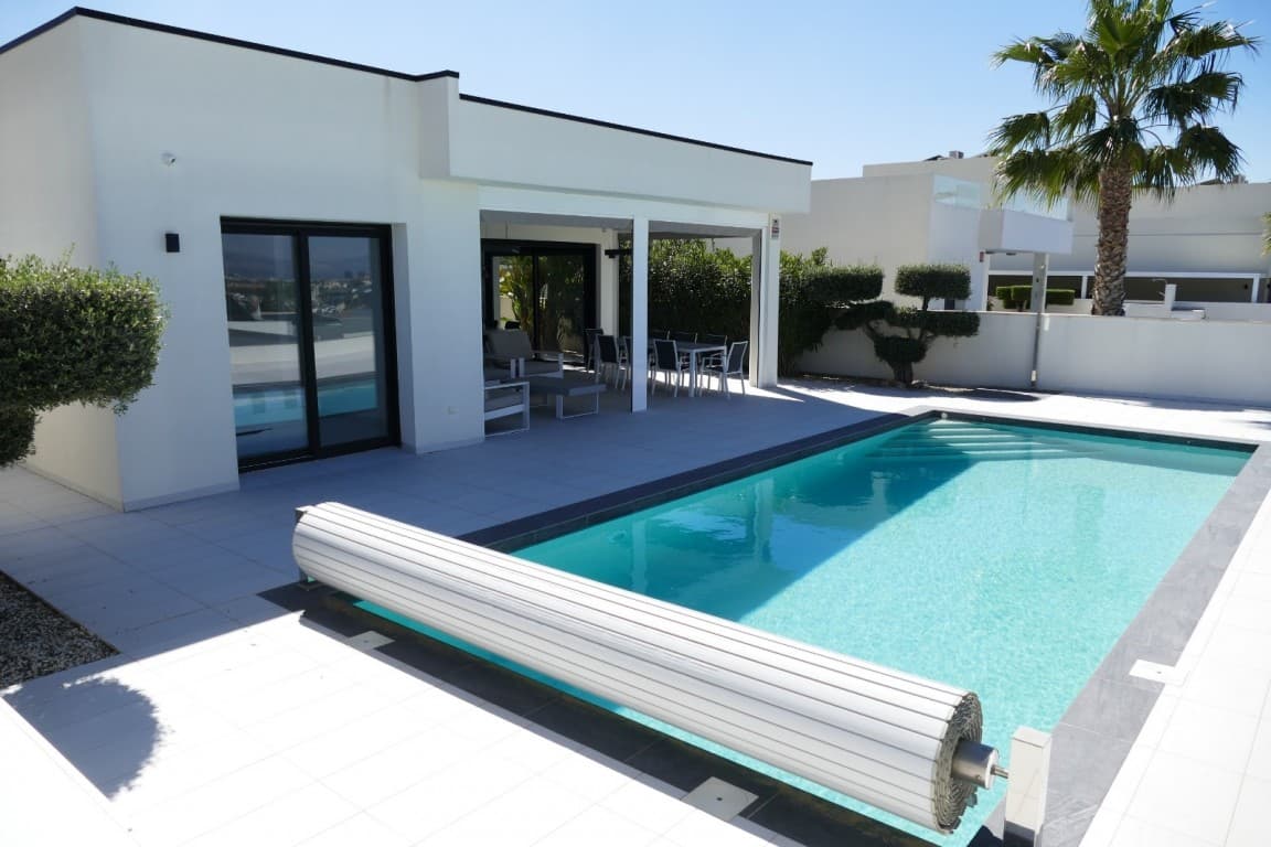 luxury villa with beautiful view. Discover this exclusive villa where luxury, comfort, and location come together perfectly. Built by a renowned Belgian developer and finished with high-quality materials, this is a home that immediately impresses.Featuring four spacious bedrooms and two stylish bathrooms, the villa offers ample space for both family living and guests. The generous living area, with its high ceilings and large sliding doors, creates an exceptional sense of light and openness. Open the doors fully and seamlessly connect indoor and outdoor living, perfect for enjoying the Mediterranean climate, the beautifully landscaped garden, the private swimming pool, and the stunning mountain views.The modern open-plan kitchen forms the heart of the home, ideal for everyday living as well as entertaining. From the living area, you step directly onto the terraces, where privacy and relaxation take center stage.Why choose this villa&8364;Move-in ready and finished to a high standardPrivate pool with heat pump, enjoy all year roundprivacy in a peaceful settingSpacious terraces and south-facing gardenPrivate parking for two cars with electric gatemany extras in the home, osmosis water,...Prime location:Situated just 1 km from all amenities and only a 13-minute drive to the beautiful beaches of Guardamar del Segura. Golf courses and Alicante Airport are within easy reach.This is your opportunity to invest in a dream home under the Spanish sun, perfect as a permanent residence, holiday home, or rental investment.Don’t miss out: properties of this quality and location are rare. Contact us today to arrange a viewing.