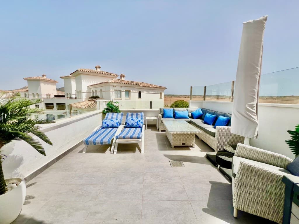Luxury South West facing 2 Bedroom 2 Bathroom Penthouse Apartment. Luxury South West Facing Penthouse in Hacienda Riquelme Golf Resort**PRICE REDUCTION - MOTIVATED SELLER**Set within the prestigious Hacienda Riquelme Golf Course gated community with 24-hour security, this exceptional, fully upgraded 2-bedroom, 2-bathroom penthouse offers refined living with breathtaking panoramic views over the golf course, communal pool, and beautifully landscaped gardens.Designed to maximise light and space, the bright open-plan living and dining area features contemporary lighting, new air conditioning, radiators, and expansive sliding glass doors that lead seamlessly onto a spectacular private terrace. Finished with elegant high-quality grey tiling and stylish outdoor furnishings, this impressive space is perfect for alfresco dining, entertaining guests, or simply relaxing in the sun while enjoying the stunning surroundings.The sleek, modern open-plan kitchen has been upgraded with quality appliances, offering both sophistication and practicality.Both bathrooms have been exquisitely modernised to a high specification, featuring walk-in showers, designer vanity units, mirrors, and WCs, with the master benefiting from a luxurious en-suite.The spacious master suite is beautifully appointed with air conditioning, a ceiling fan with integrated lighting, radiator, and direct access via double doors to a private front balcony—an idyllic setting for morning coffee with serene garden views.The guest bedroom is equally well presented, complete with fitted sliding wardrobes, air conditioning, ceiling fan, radiator, and its own access to the balcony, perfectly suited for guests or family.Fully furnished, key-ready home—just bring your suitcase.Additional features include an underground allocated parking space with remote-controlled access and private storage unit.Ideally located just a short stroll from the on-site restaurant, supermarket, and café, and only 5 minutes from the charming village of Sucina with its wide range of amenities. The property is also just 20 minutes from Corvera Airport and perfectly positioned to explore the Costa Cálida, including the historic cities of Murcia and Cartagena, and the beautiful beaches of the Mar Menor.A truly outstanding penthouse offering luxury, comfort, and an enviable lifestyle in one of the region’s most sought-after golf resorts.