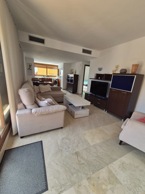 Penthouse with ocean view in Punta Prima. This elegantly finished penthouse is located in the prestigious La Entrada resort in Punta Prima and offers a perfect combination of luxury, comfort, and a prime location. Just 300 meters from the Mediterranean Sea, you enjoy all amenities within easy reach: restaurants, bars, shops, supermarkets, a bakery, and public transport are all within walking distance.With a living area of &8203;&8203;approximately 85 m², the apartment is spacious and brightly furnished. The stylish living room seamlessly connects to a modern open kitchen, fully equipped with high-quality built-in appliances. Large windows provide an abundance of natural light and enhance the sense of space and elegance.The penthouse features two spacious bedrooms and two bathrooms. The master bedroom has an en-suite bathroom with a walk-in shower, while the second bathroom is equipped with a bathtub. Comfort is paramount thanks to high-quality finishes, air conditioning, Wi-Fi, and an integrated alarm system.The outdoor spaces are the absolute highlight. The 15 m² southwest-facing terrace offers stunning views of the tropical gardens, swimming pools, and the sea. In addition, the property features a spacious private roof terrace of 35 m², fully furnished with a lounge set, sunbeds, parasols, and a large dining area, ideal for long sunny days and atmospheric evenings.The gated resort is known for its lush subtropical gardens, three elegant swimming pools, and 24/7 security, guaranteeing peace, privacy, and safety.The surrounding area offers numerous recreational opportunities, including water sports, golf, horse riding, and lively nightlife venues. The popular La Zenia Boulevard shopping center is also located nearby.Thanks to its excellent location near the sea and amenities, combined with high-quality finishes, this property is a particularly interesting investment. The penthouse is highly sought after for (holiday) rentals and enjoys a high occupancy rate. The property is move-in ready and immediately ready for rental, ensuring an attractive and stable return.This penthouse offers a unique living experience on the Costa Blanca, perfect as a second home, investment, or permanent residence.