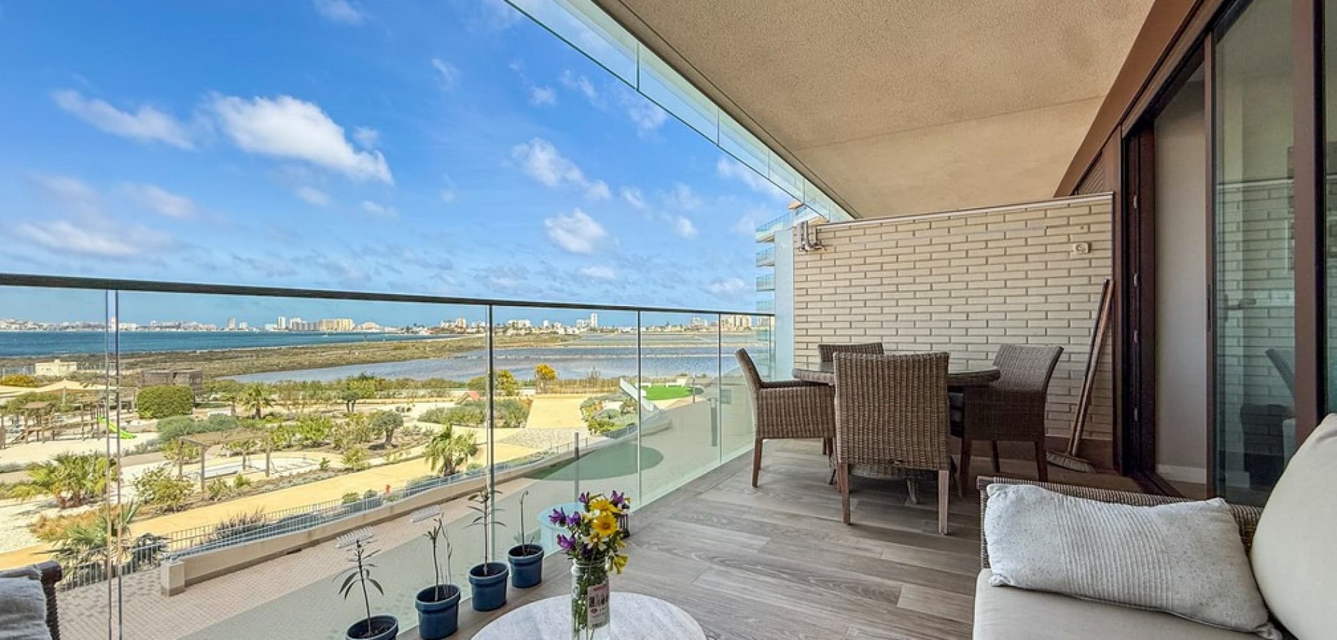 Experience refined coastal living in this stylish 2nd-floor apartment, ideally located within the prestigious Los Flamencos residential complex in Playa Paraíso, Cartagena. Just steps from the beach, this beautifully presented home offers stunning views of the Mar Menor and the Mediterranean Sea from its private terrace.The apartment features 2 spacious bedrooms and 2 modern bathrooms, designed with comfort and functionality in mind. The bright open-plan living and dining area connects seamlessly with a fully equipped kitchen, creating a welcoming space perfect for both relaxing and entertaining. Finished to a high standard throughout, the property also benefits from air conditioning and is sold fully furnished.Additional highlights include a private underground parking space and storage room, making it an ideal choice for year-round living, a holiday escape, or a strong rental investment.Key Features:2 spacious bedrooms2 modern bathrooms2nd-floor apartment with sea viewsPrivate terraceFully furnishedAir conditioning throughoutUnderground parking & storageExclusive Community Amenities:Beachfront swimming pool areaIndoor spa with wellness facilitiesFully equipped gymLandscaped gardens & picnic areasCo-working office & events space (bookable)Dog park & birdwatching towerChildren’s playgroundLos Flamencos offers a unique combination of resort-style living and natural surroundings, all within walking distance of the beach and close to local amenities in Playa Honda and La Manga.